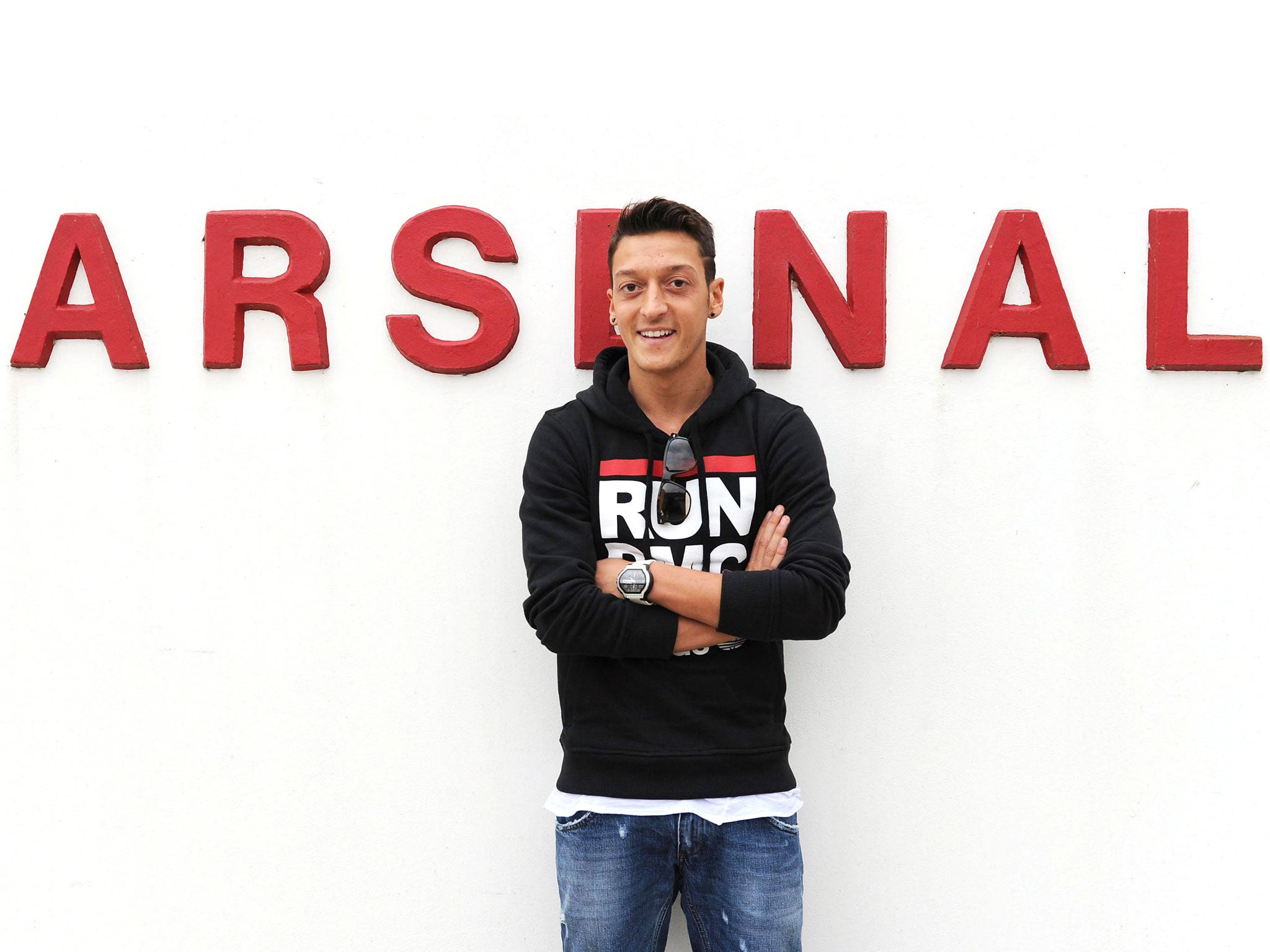 Mesut Ozil poses outside Arsenal's training ground