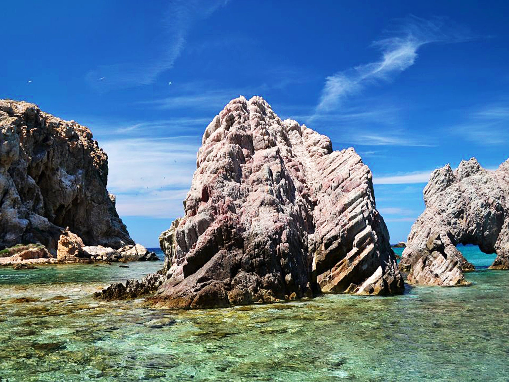 Island life: Antiparos's character is distinctlyCycladic – its buildings finished in blue, its sea turquoise, its streets and markets unpretentious