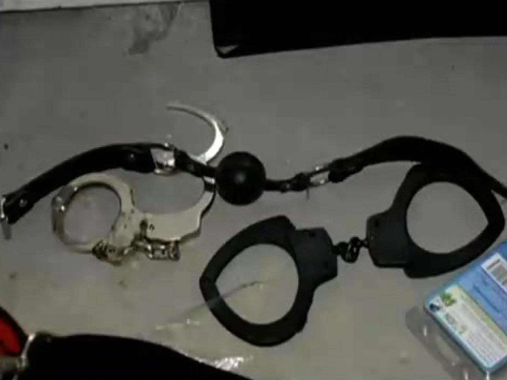 Handcuffs were found in the room, alongside knives and a child-sized coffin