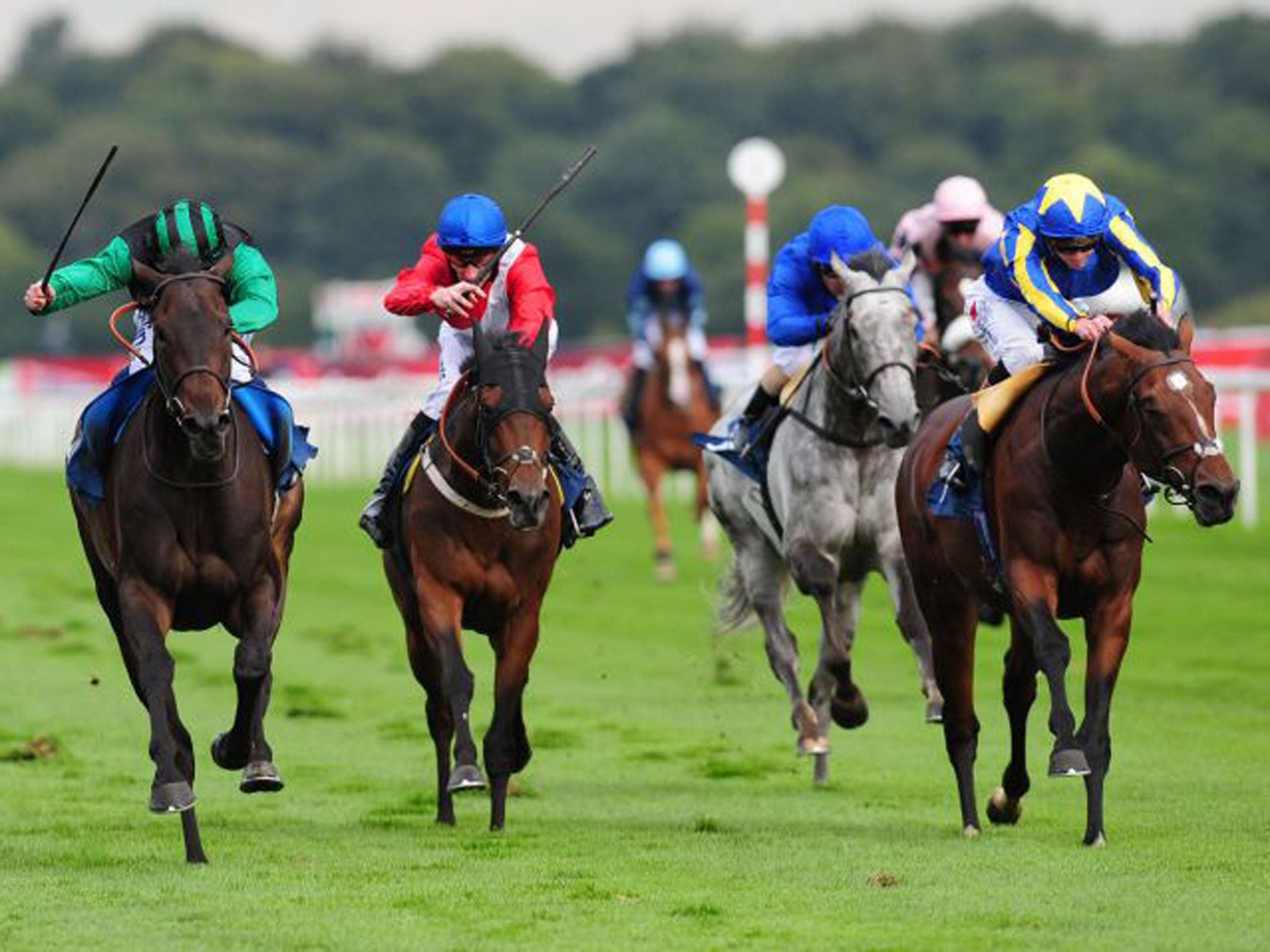 Times Up, left, ridden by Ryan Moore, wins the Speedy Services Doncaster Cup, at Doncaster yesterday