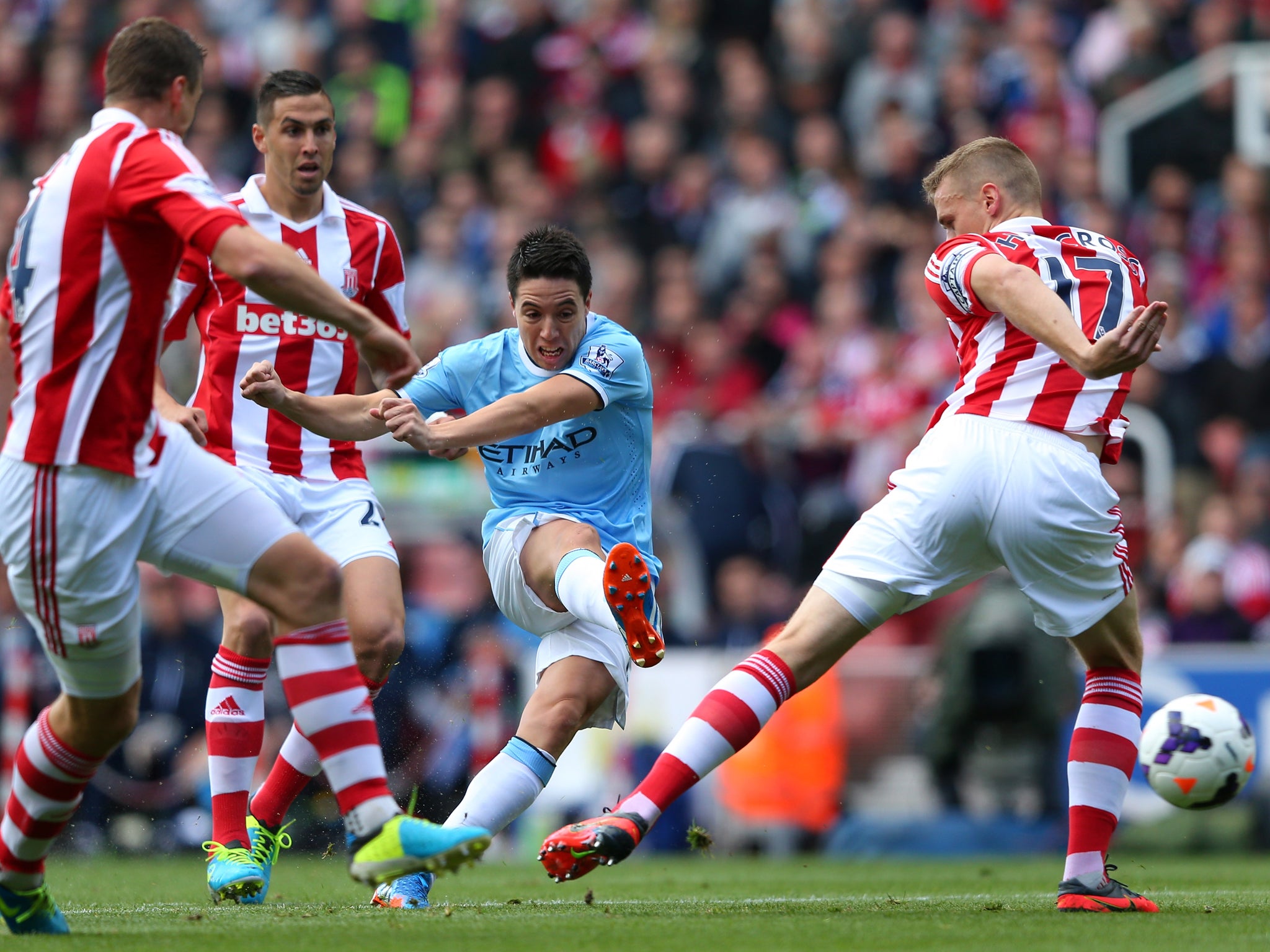 Samir Nasri shoots for Manchester City against Stoke