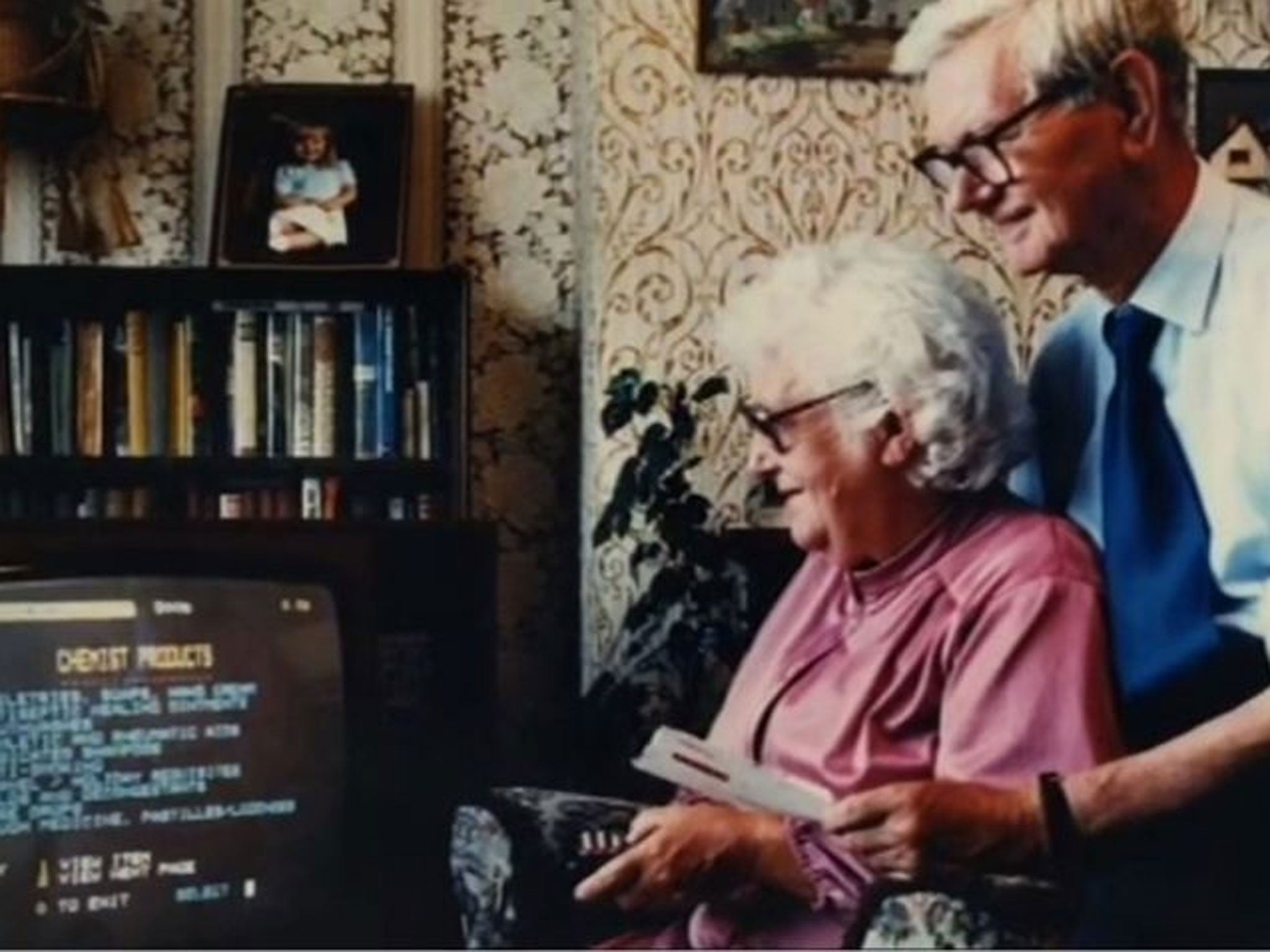 Mrs Snowball chooses her groceries from her armchair