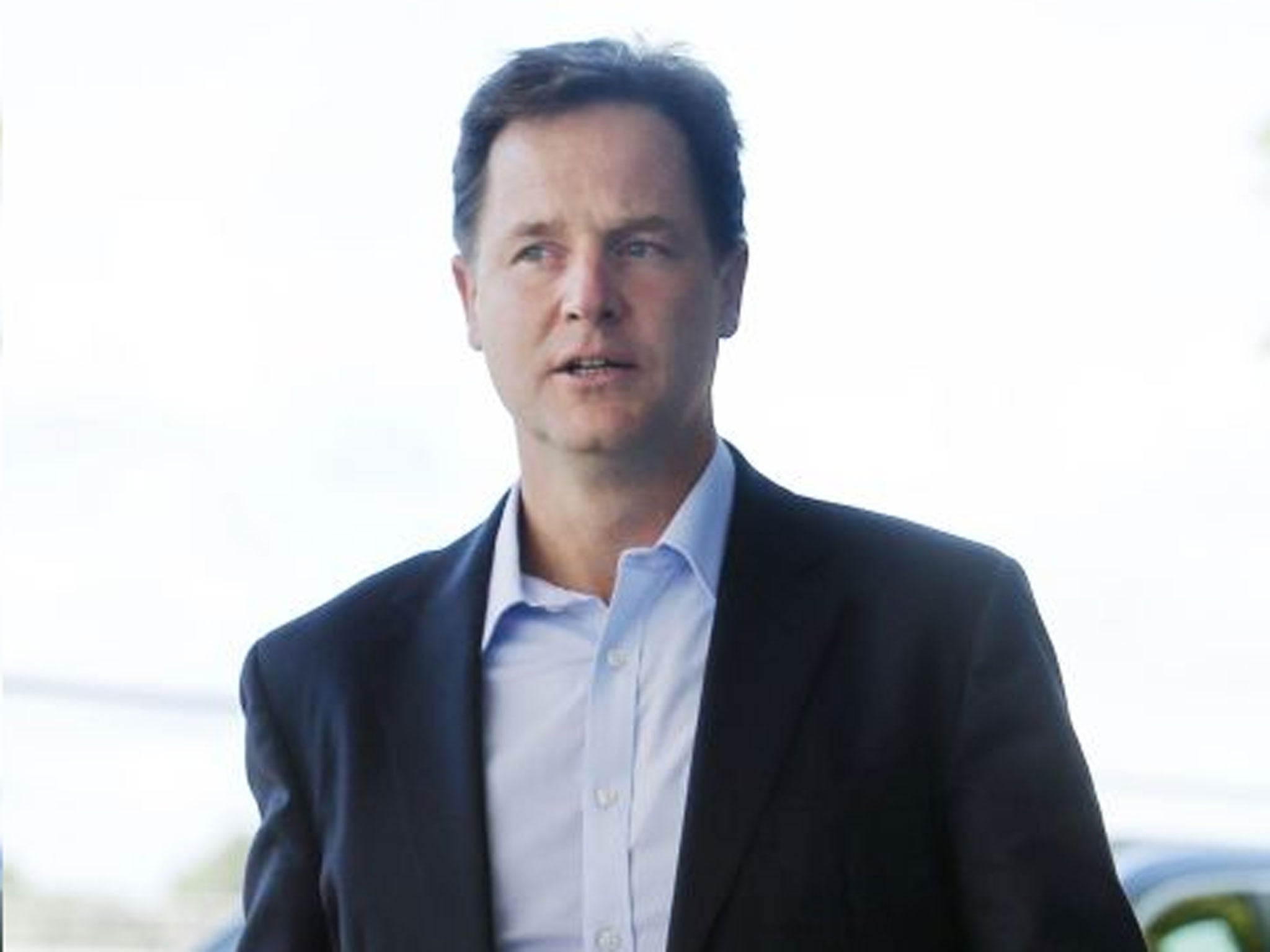 Out of step: Nick Clegg adheres to the Tories, but Lib Dem members veer to Ed Miliband’s Labour