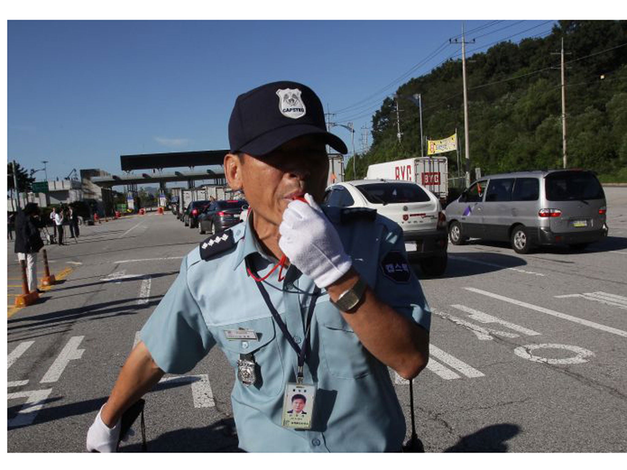 A South Korean guard is on patrol at the customs, immigration and quarantine office as South Korean workers approach Kaesong Park on 16 September.