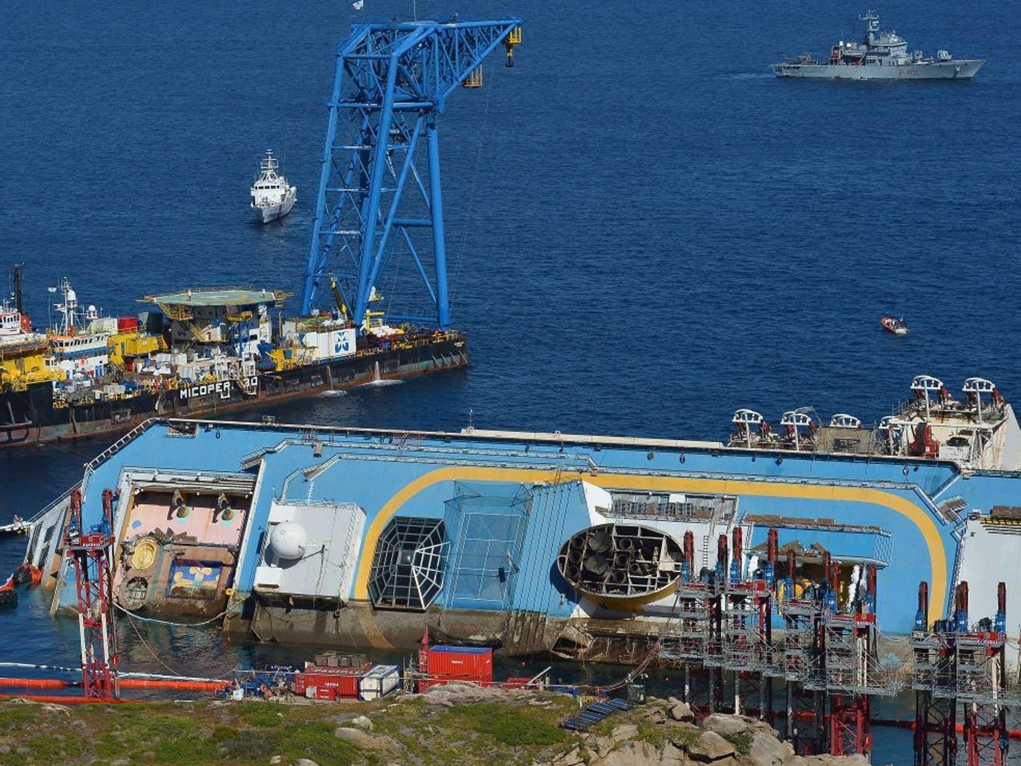 The wreck of the Costa Concordia liner is up-righted near Giglio, with the line on the top deck showing progress since this morning