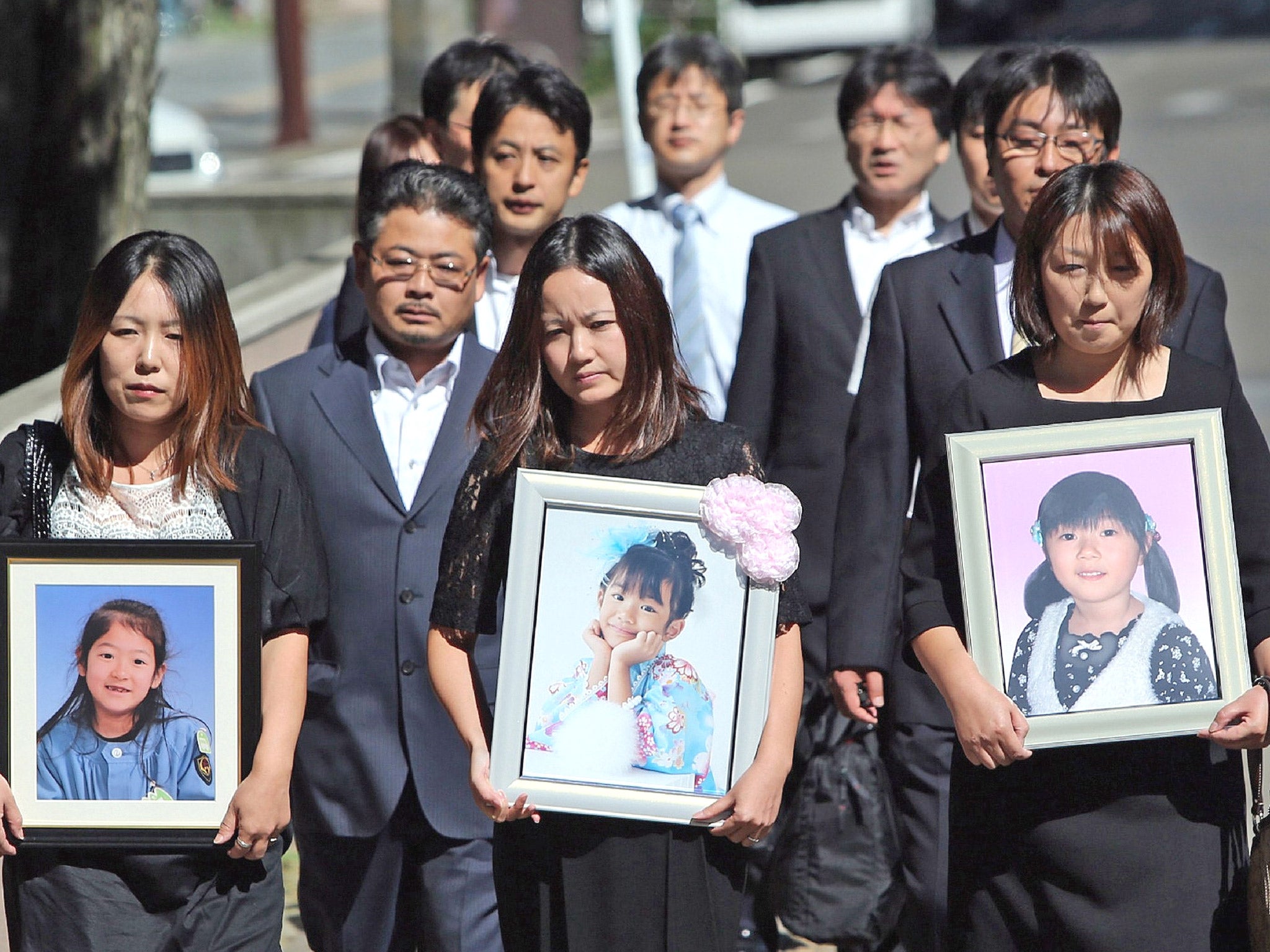 Family members of the children killed in the tsunami attend Sendai District Court