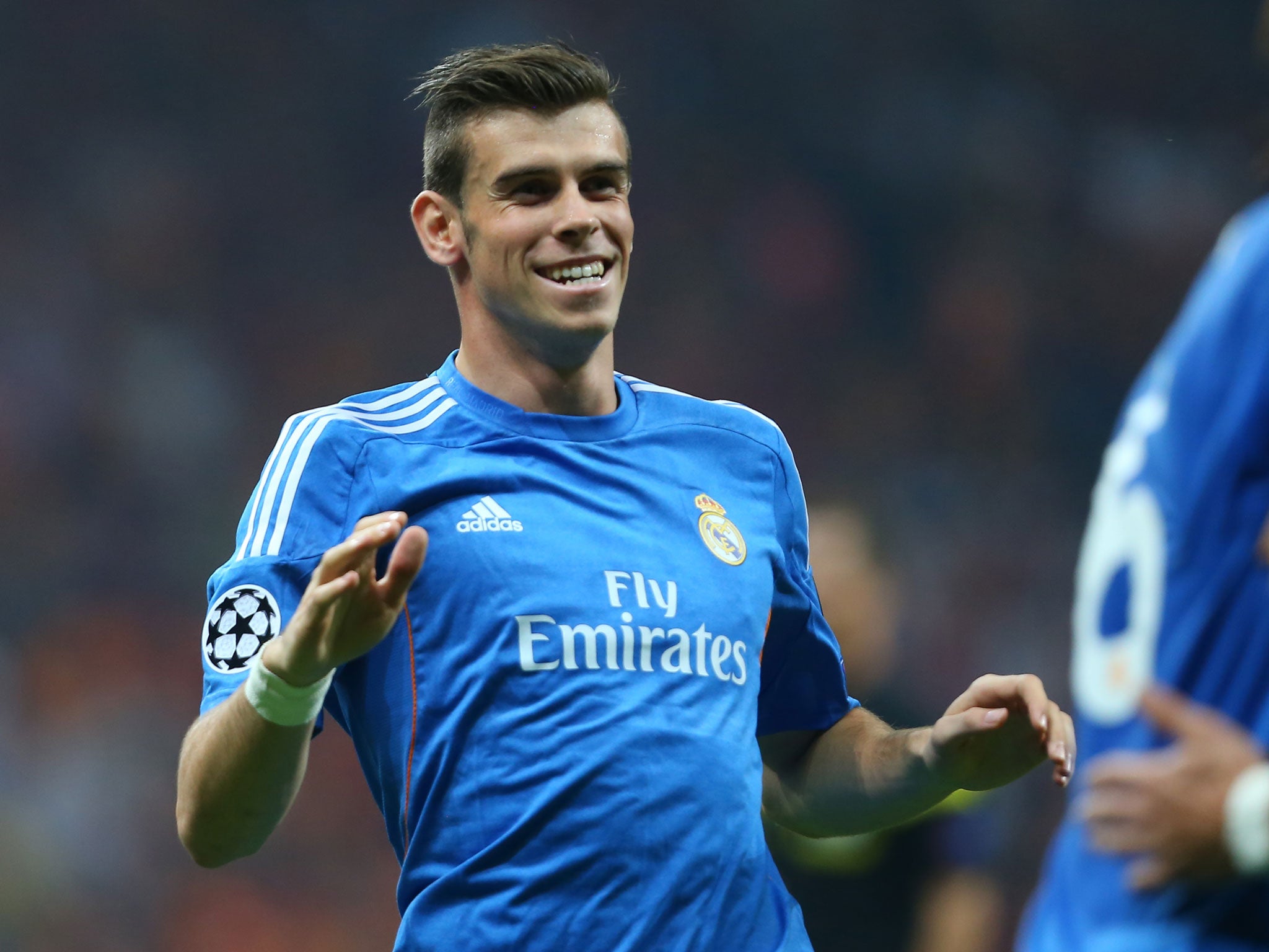 Gareth Bale celebrates after providing the assist for one of Cristiano Ronaldo's goals against Galatasaray in the Champions League