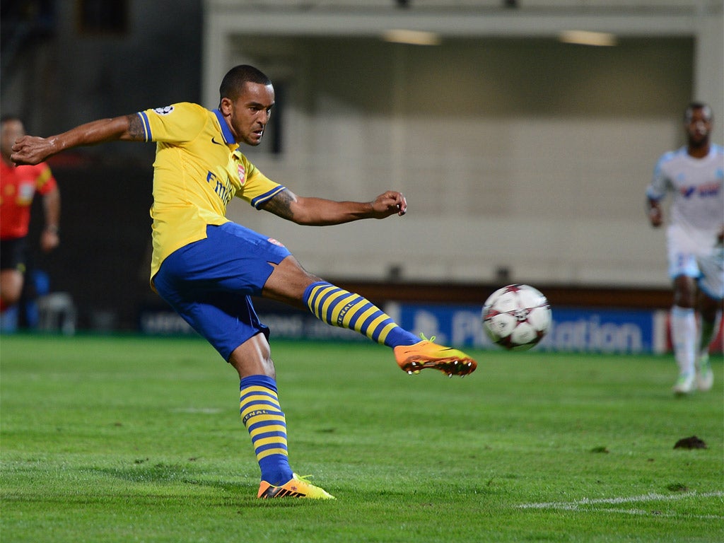 Walcott connects sweetly with a volley to put the Gunners in front