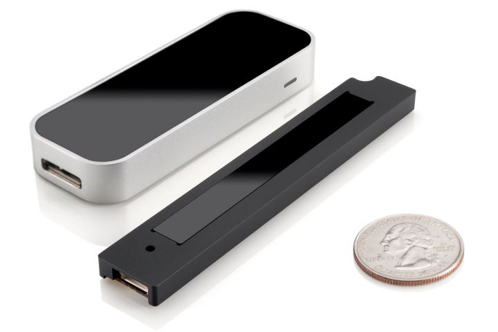 On the left, Leap Motion's original USB peripheral; on the right, the new slimmer device embedded in HP's laptop.