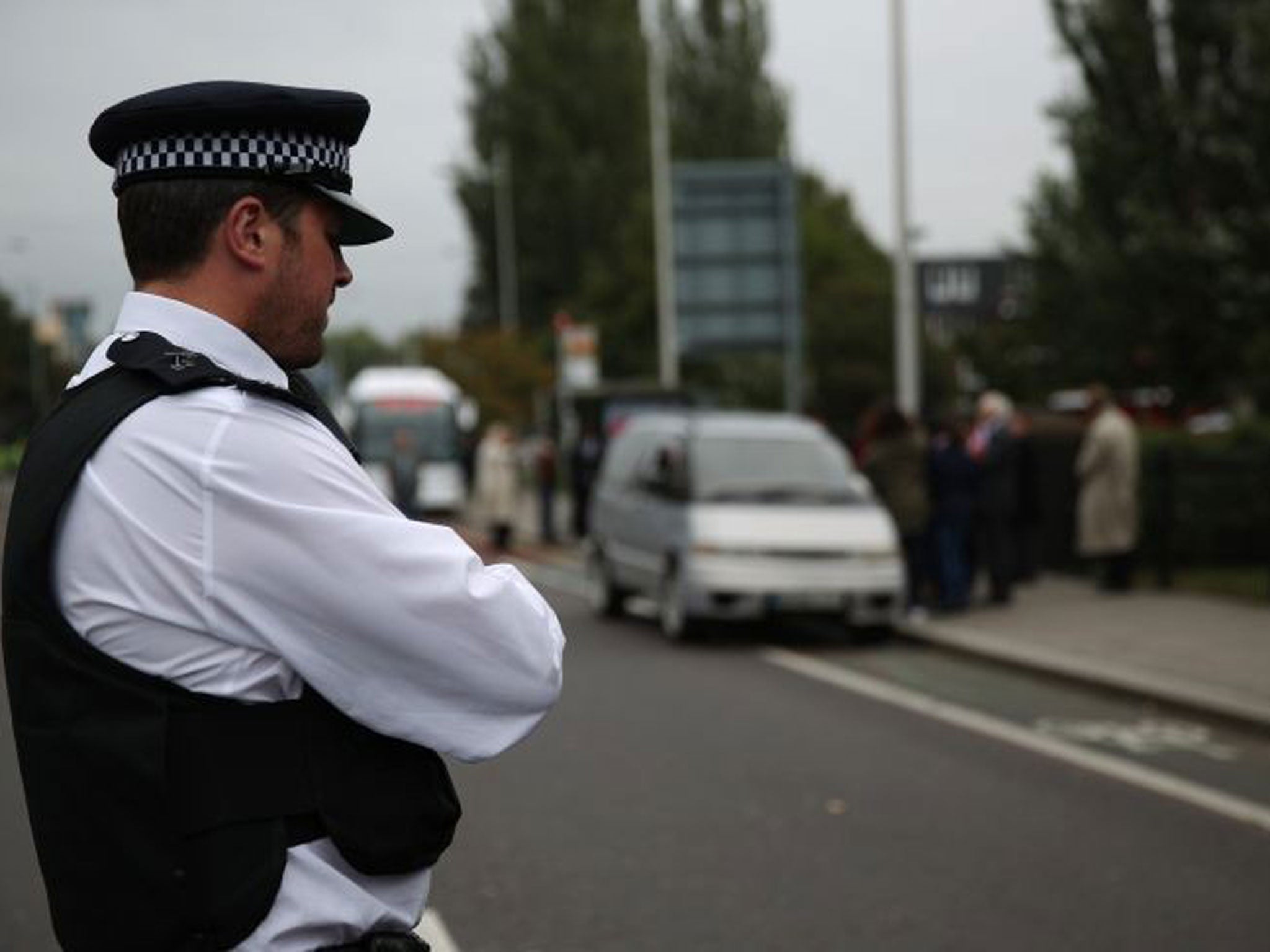 A policeman at the scene of Mark Duggan's shooting in Tottenham during a visit by the inquest jury