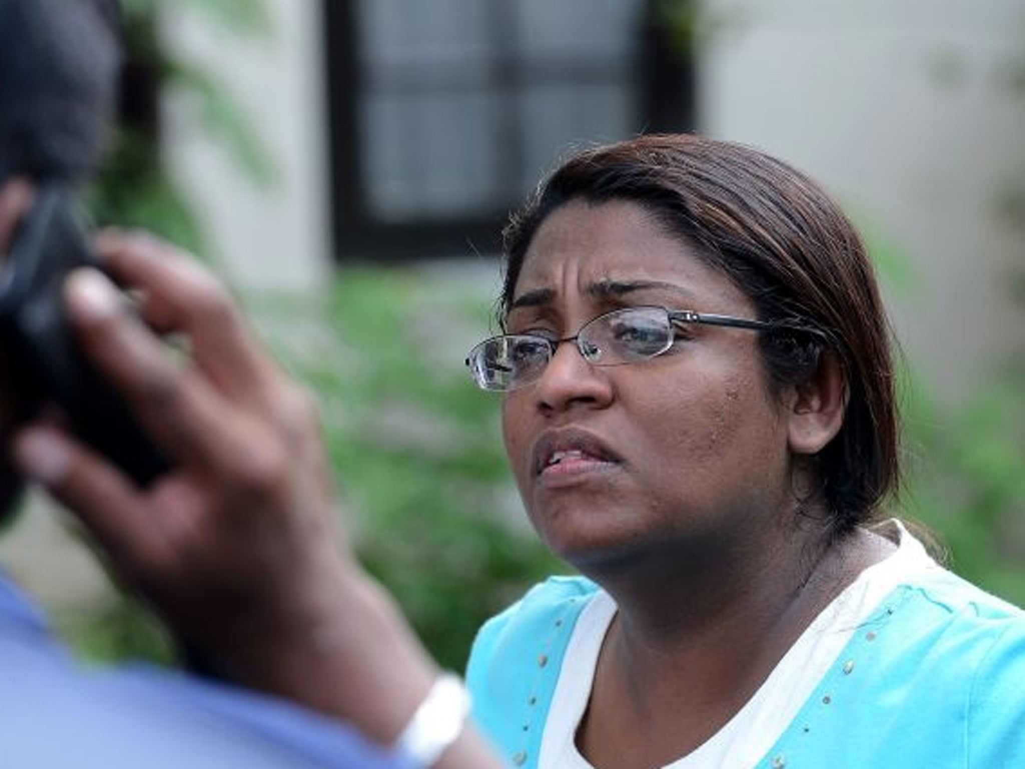 The Associate Editor of Sri Lankan newspaper Sunday Leader , Mandana Ismail Abeywickrema speaks with colleagues