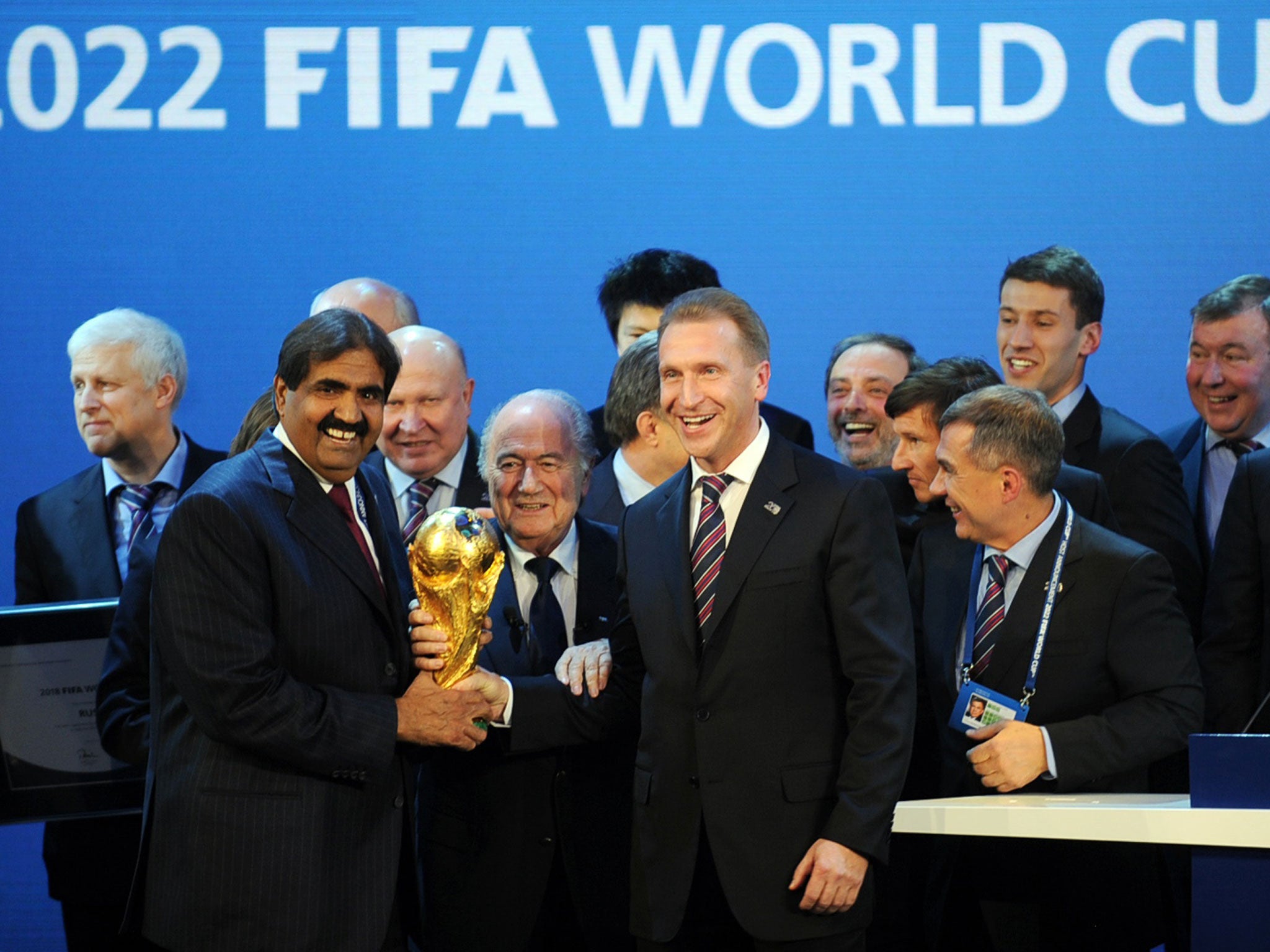 Sheikh Hamad bin Khalifa Al-Thani (left) and Fifa President Sepp Blatter pose with the World Cup after the Qatar announcement in 2010