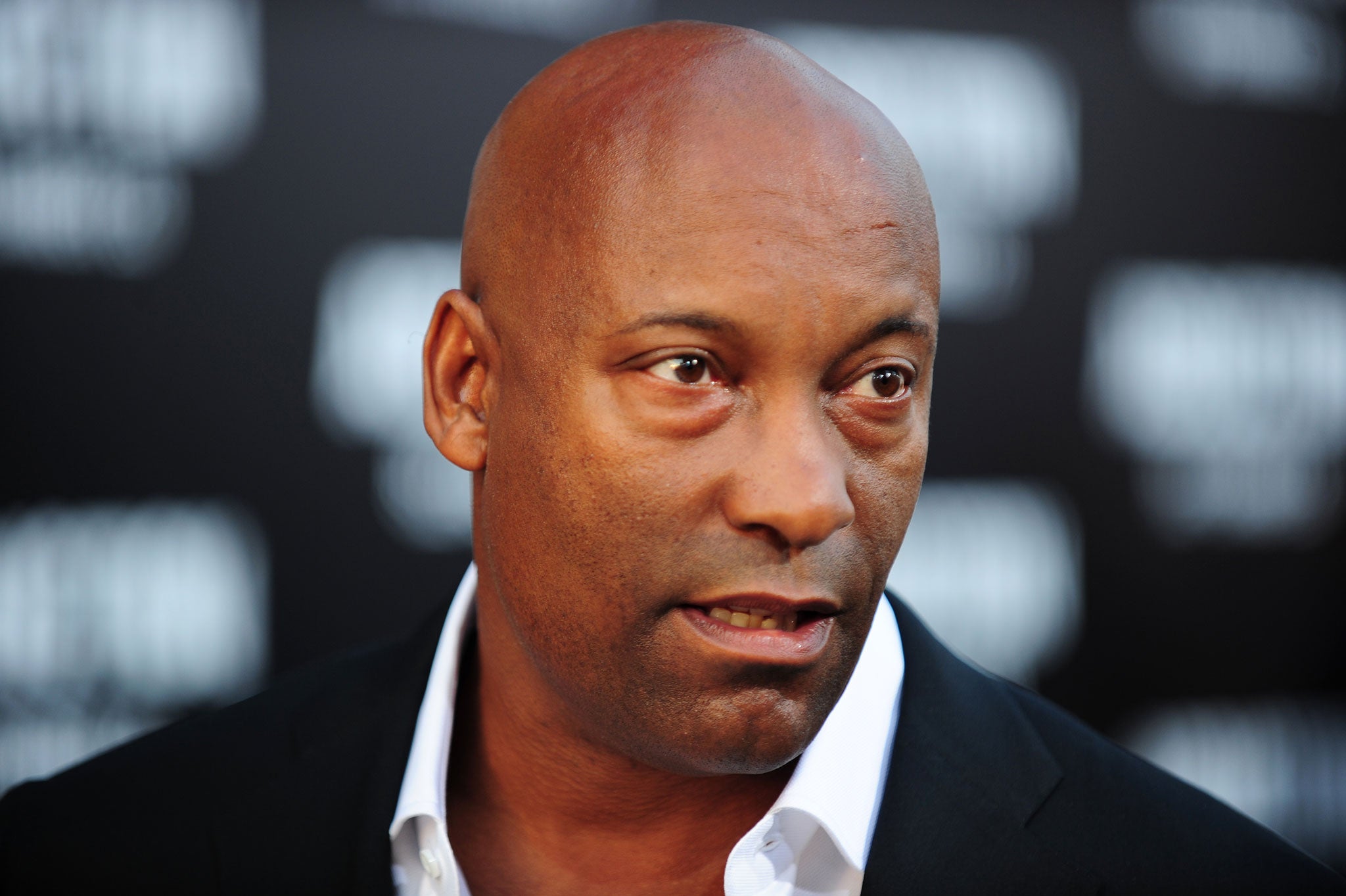 John Singleton believes black directors should tell "black stories"