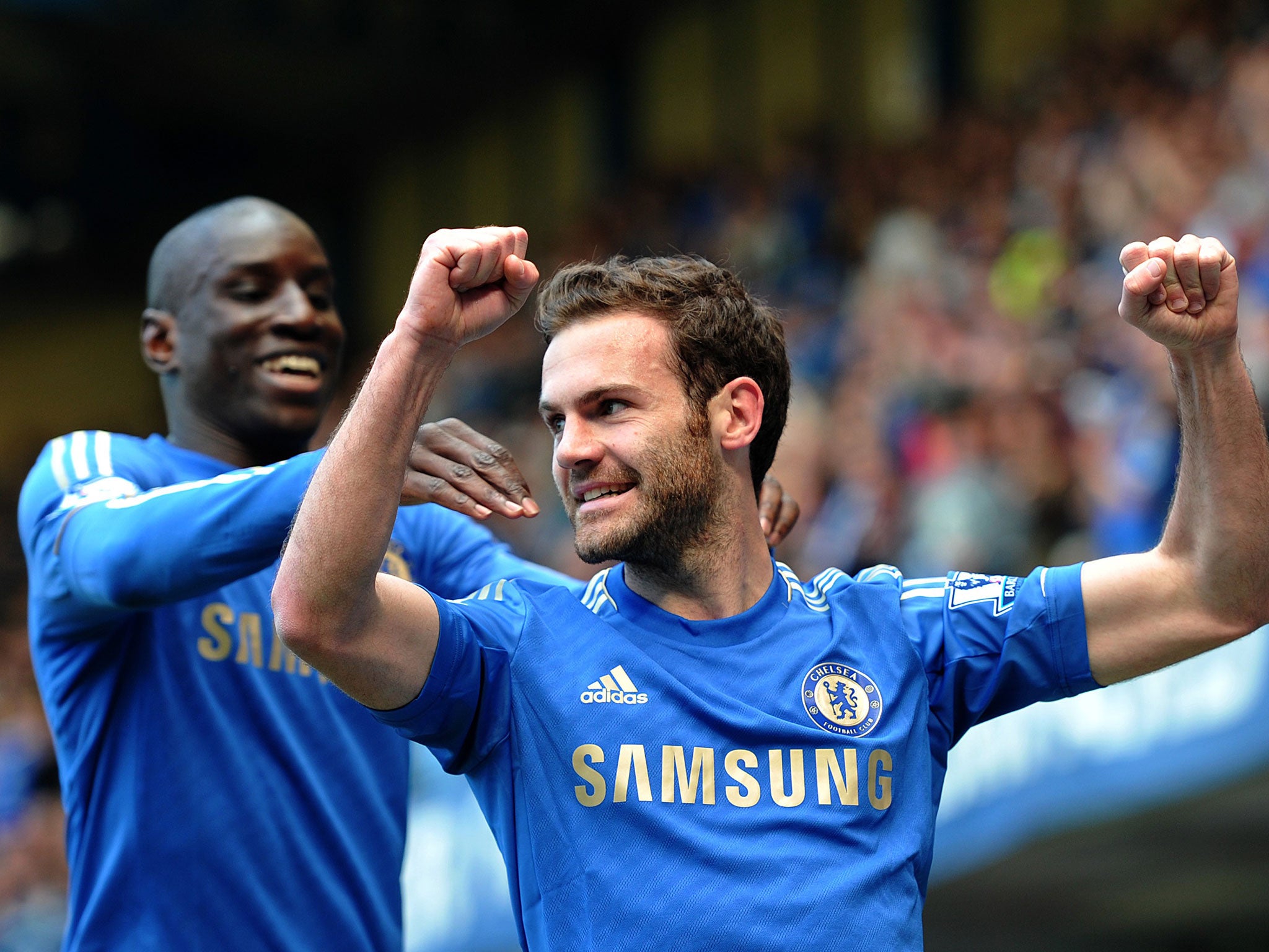 Juan Mata in celebratory mood with team-mate Demba Ba