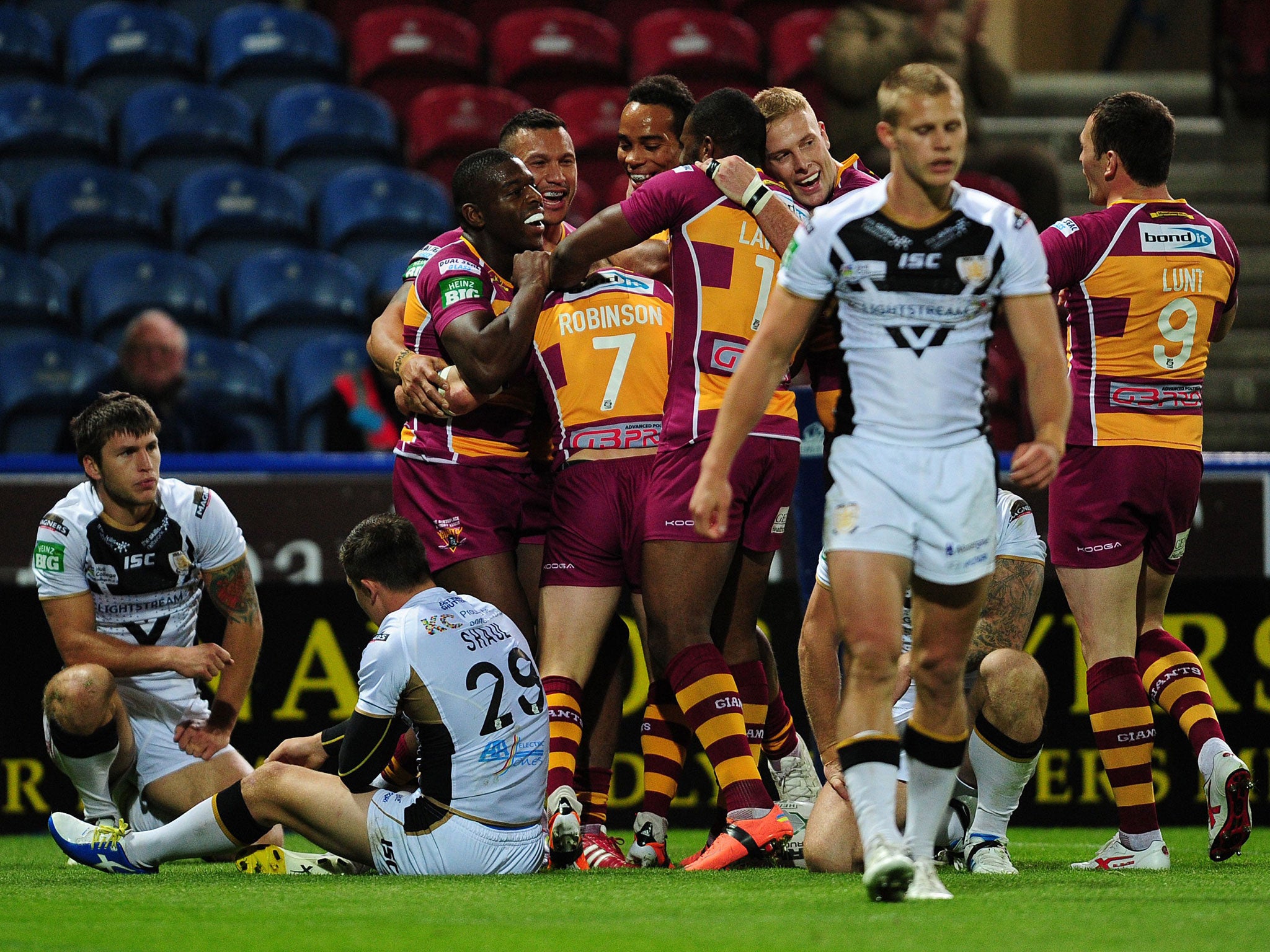 Huddersfield Giants' Luke Robinson (centre) celebrates with teammates