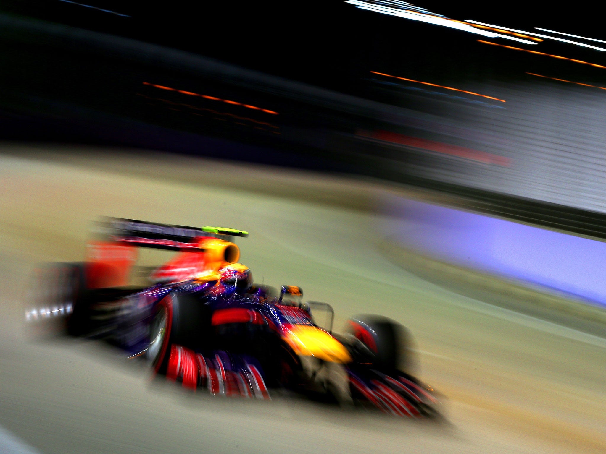 SINGAPORE - SEPTEMBER 21: Mark Webber of Australia and Infiniti Red Bull racing drives during qualifying for the Singapore Formula One Grand Prix at Marina Bay Street Circuit. GETTY IMAGES