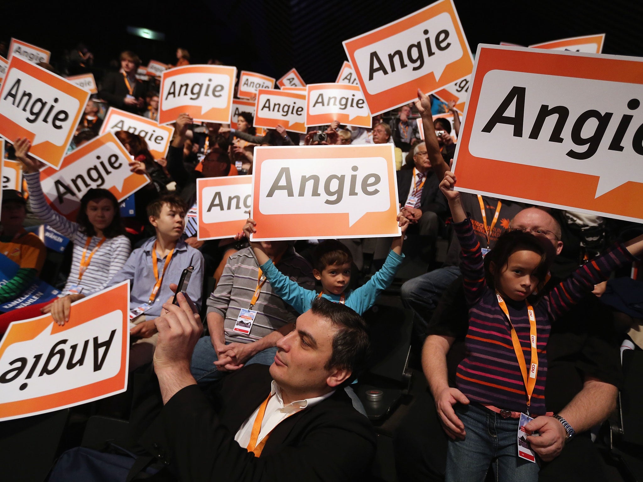 Votes for Angela: But will they be enough? Supporters in Berlin, yesterday