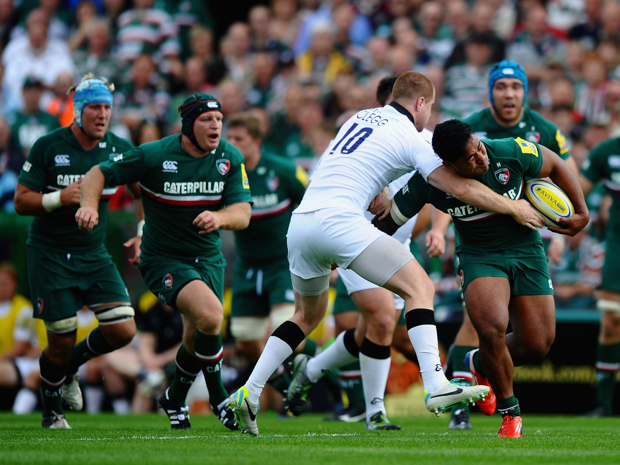 Manu Tuilagi attempts to break clear of Newcastle fly-half Rory Clegg