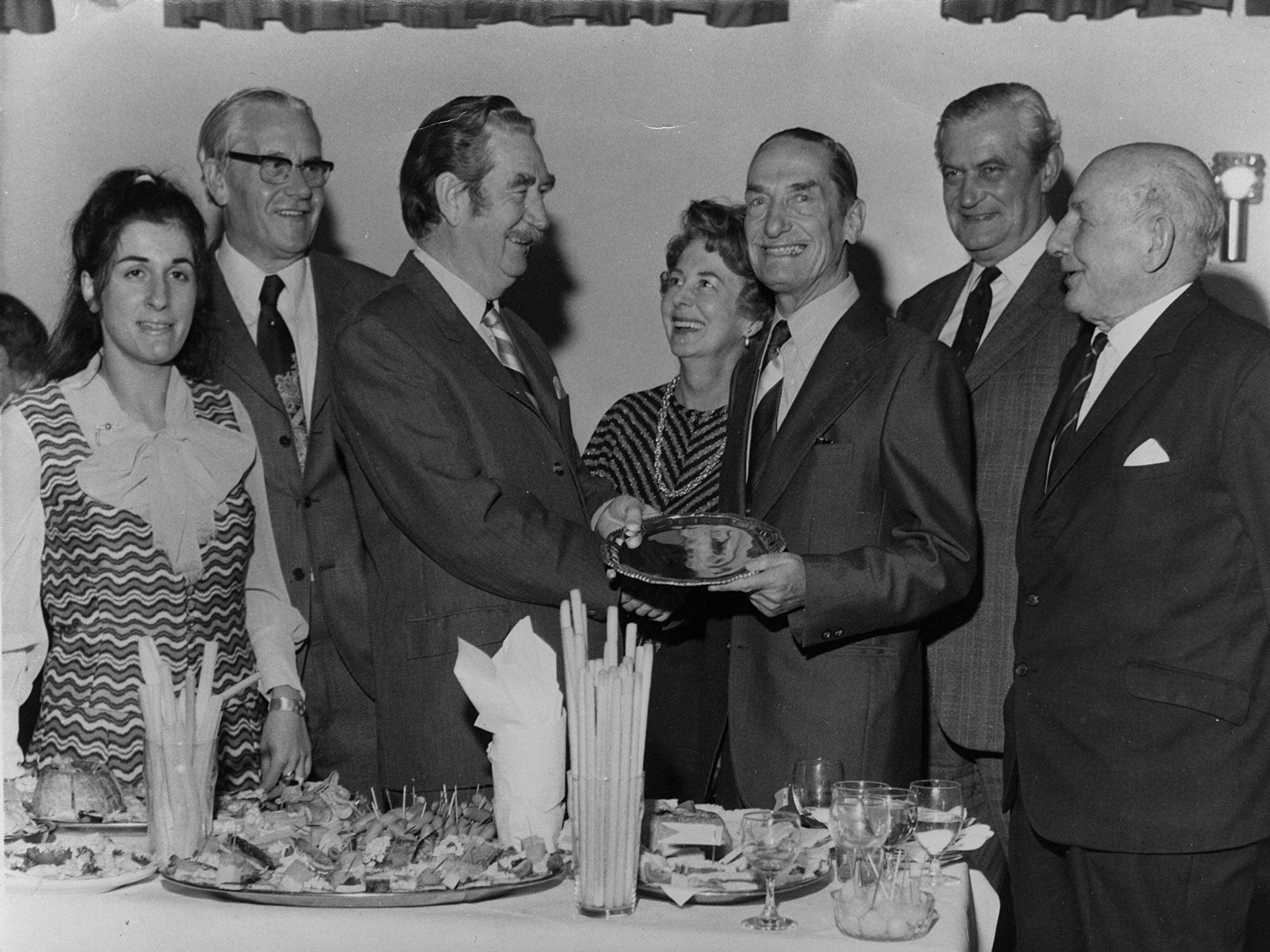 Ball of confusion: Nottinghamshire Supporters’ Association secretaries Jose Miller (far left) and John Gough (third from left) at Gough’s leaving party, when he presented her with the ball