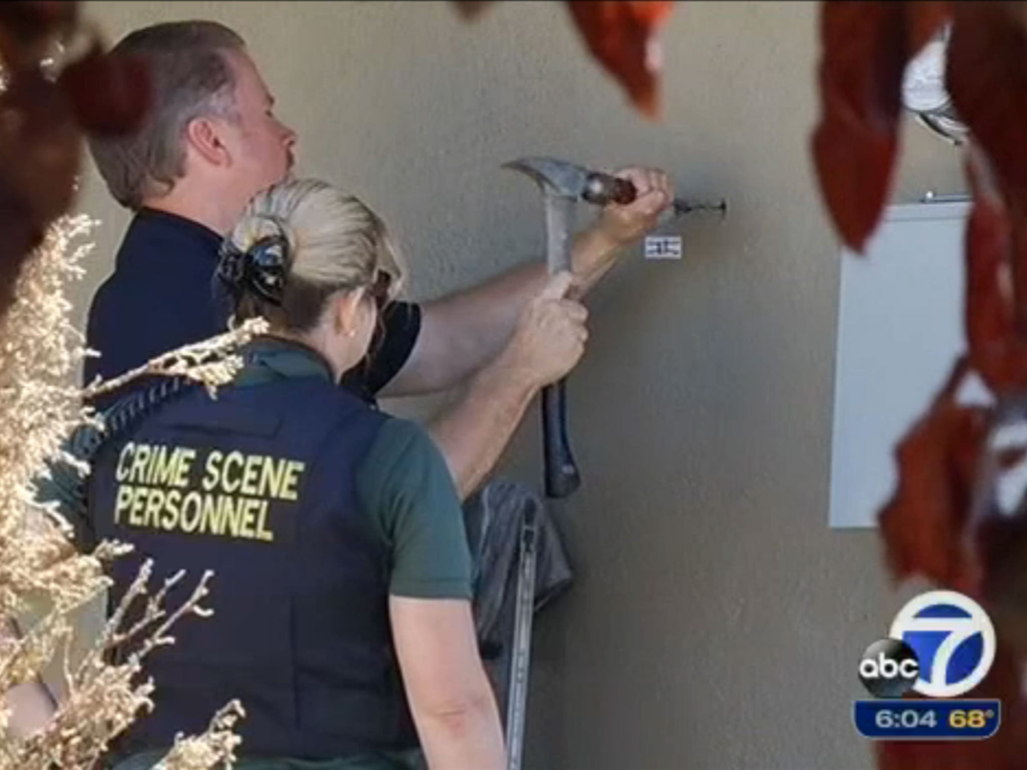 ABC7 News footage shows police investigating holes where bullets from a drive-by shooting entered the building and hit a 10-year-old girl while she slept