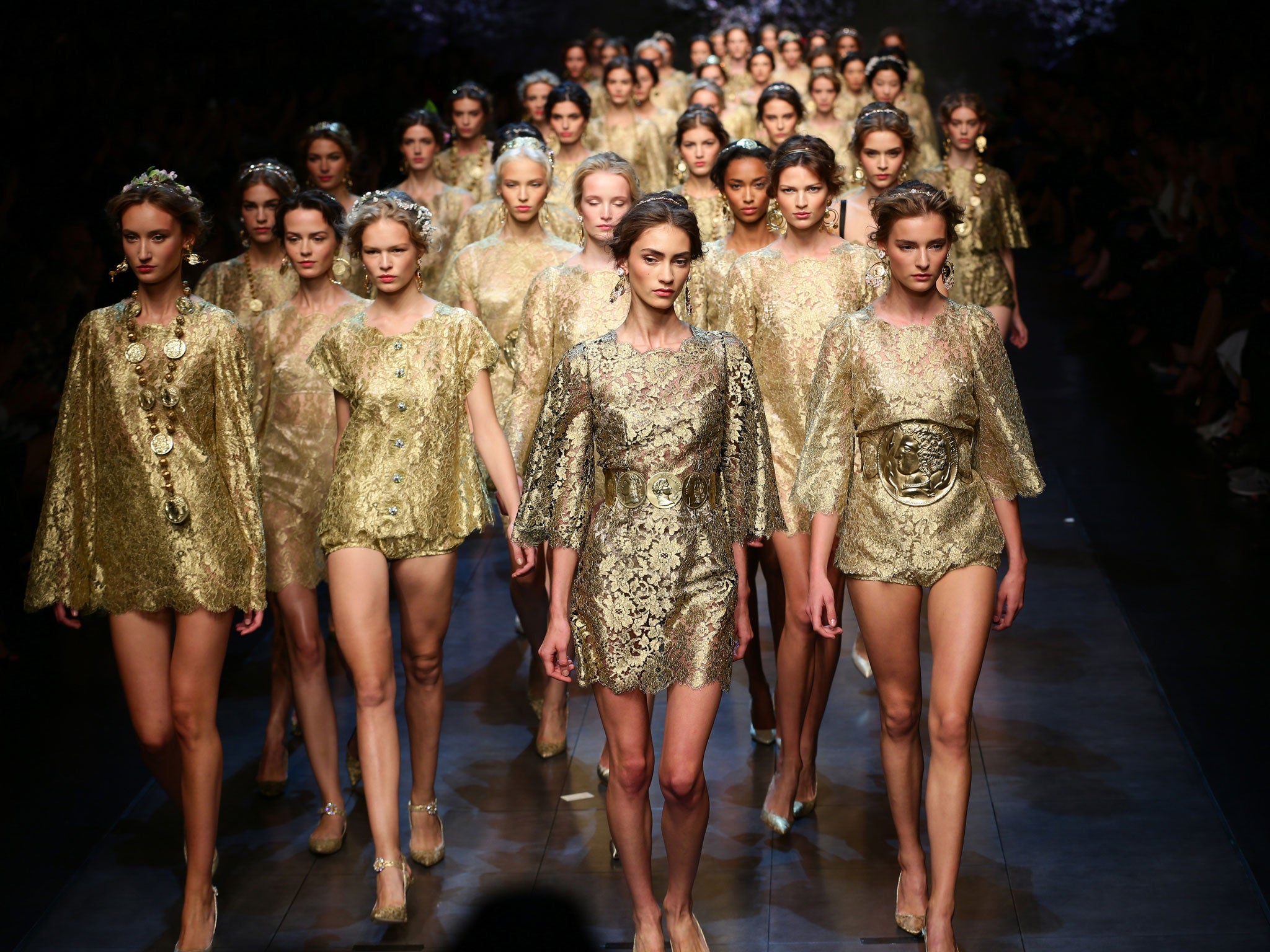 MILAN, ITALY - SEPTEMBER 22: Models walk the runway during the Dolce & Gabbana show as part of Milan Fashion Week Womenswear Spring/Summer 2014 . GETTY IMAGES
