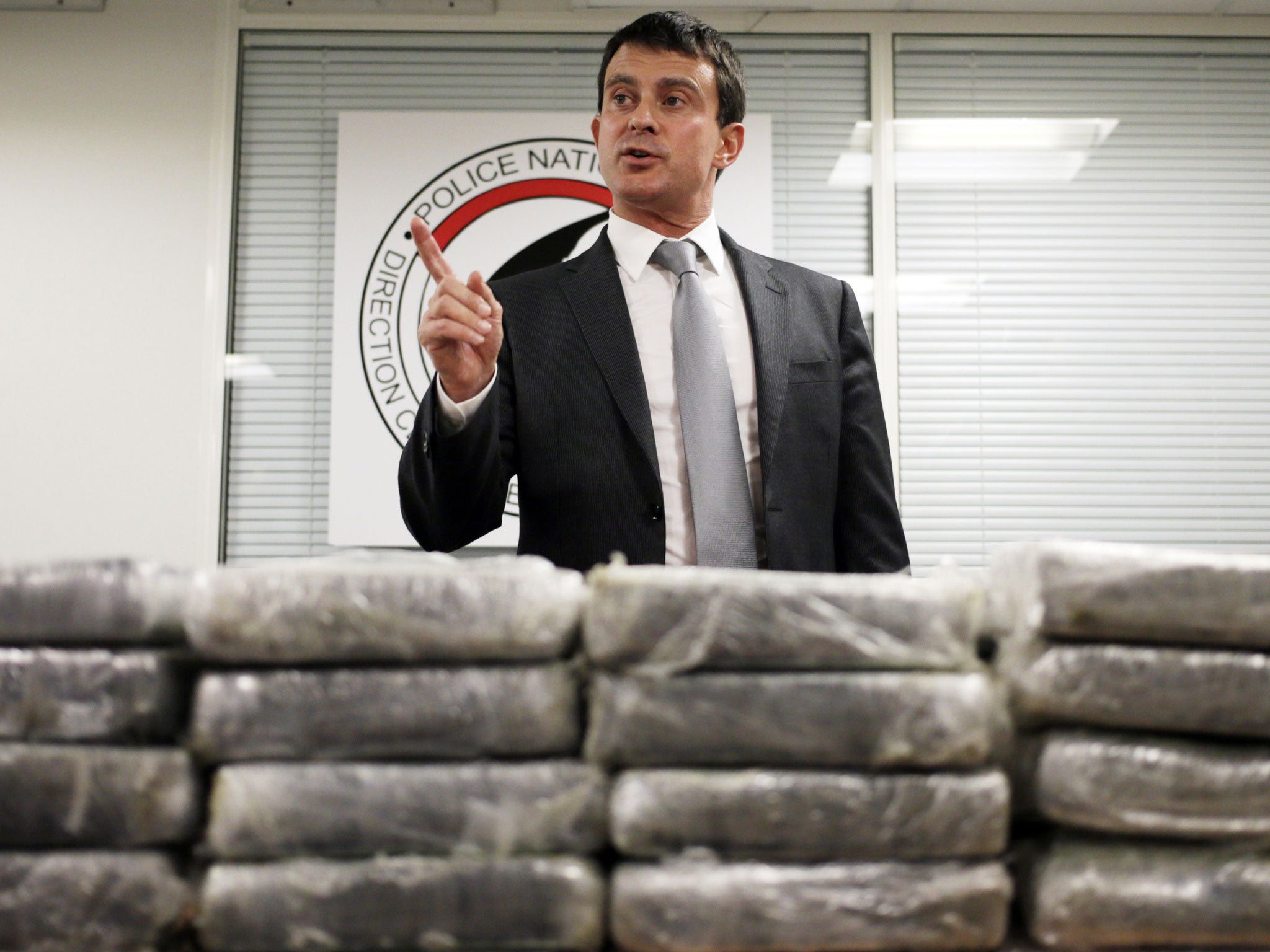 Interior minister Manuel Valls with some of the drugs haul