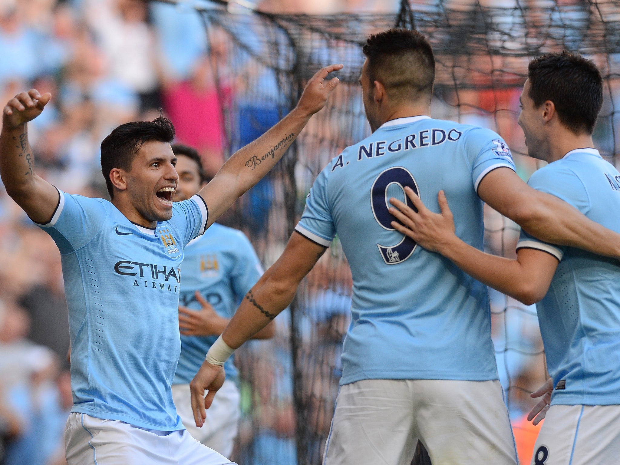 Sergio Aguero celebrates with Alvaro Negredo and Samir Nasri