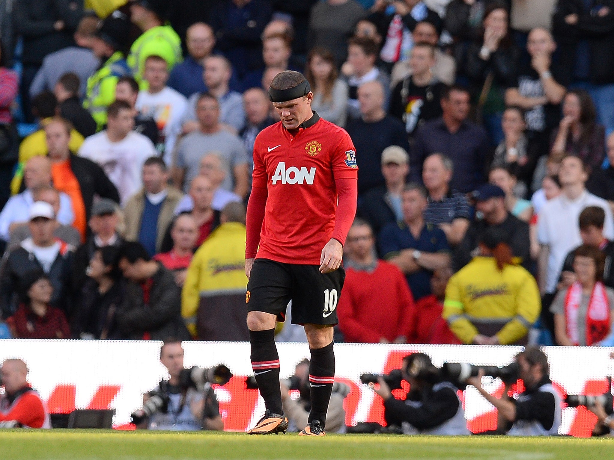 Wayne Rooney cut a dejected figure despite scoring to become the leading goalscorer in the Manchester derby