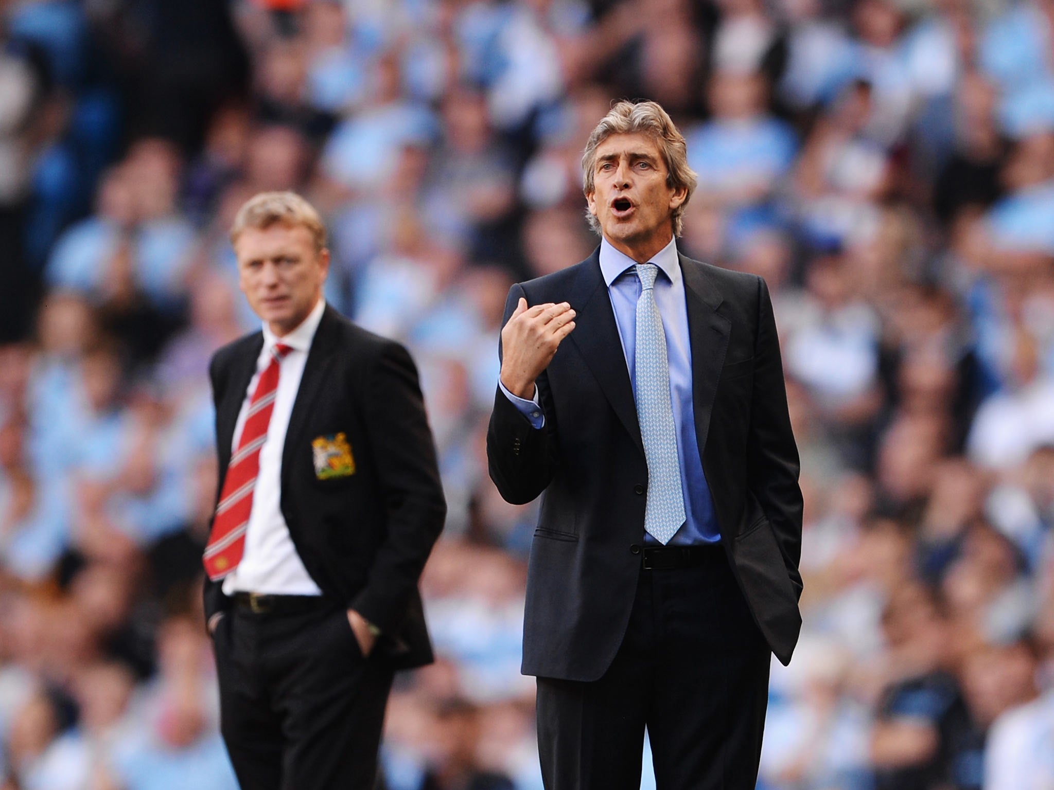 David Moyes manager of Manchester United (L) and Manuel Pellegrini manager of Manchester City