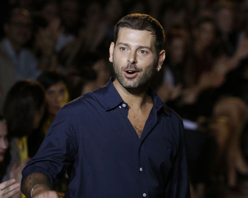 Italian fashion designer Fausto Puglisi after presenting his women's Spring-Summer 2014 collection