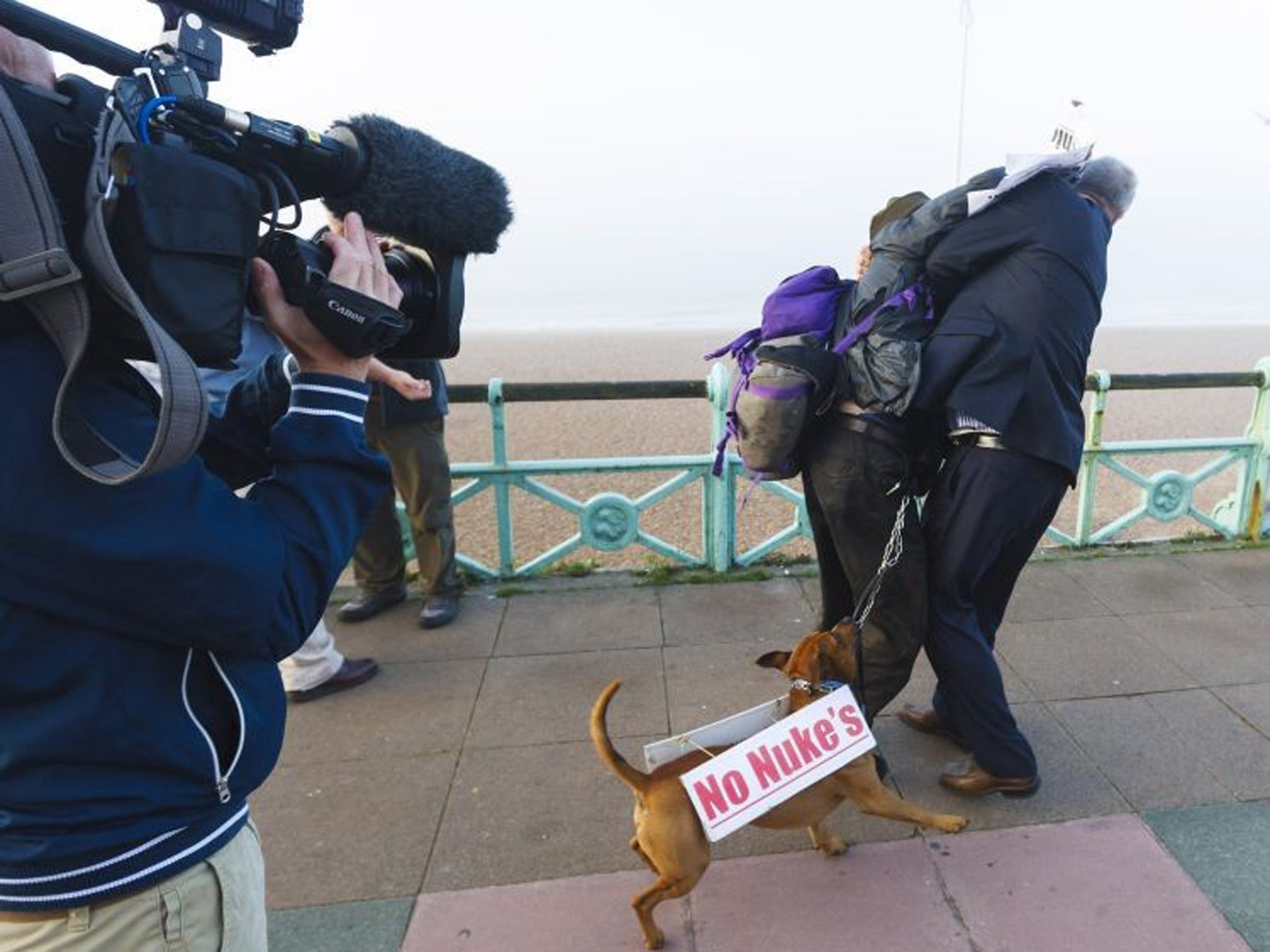 Iain Dale scuffles with protester Stuart Holmes (left) close to where former Labour spin doctor Damian McBride was giving a television interview