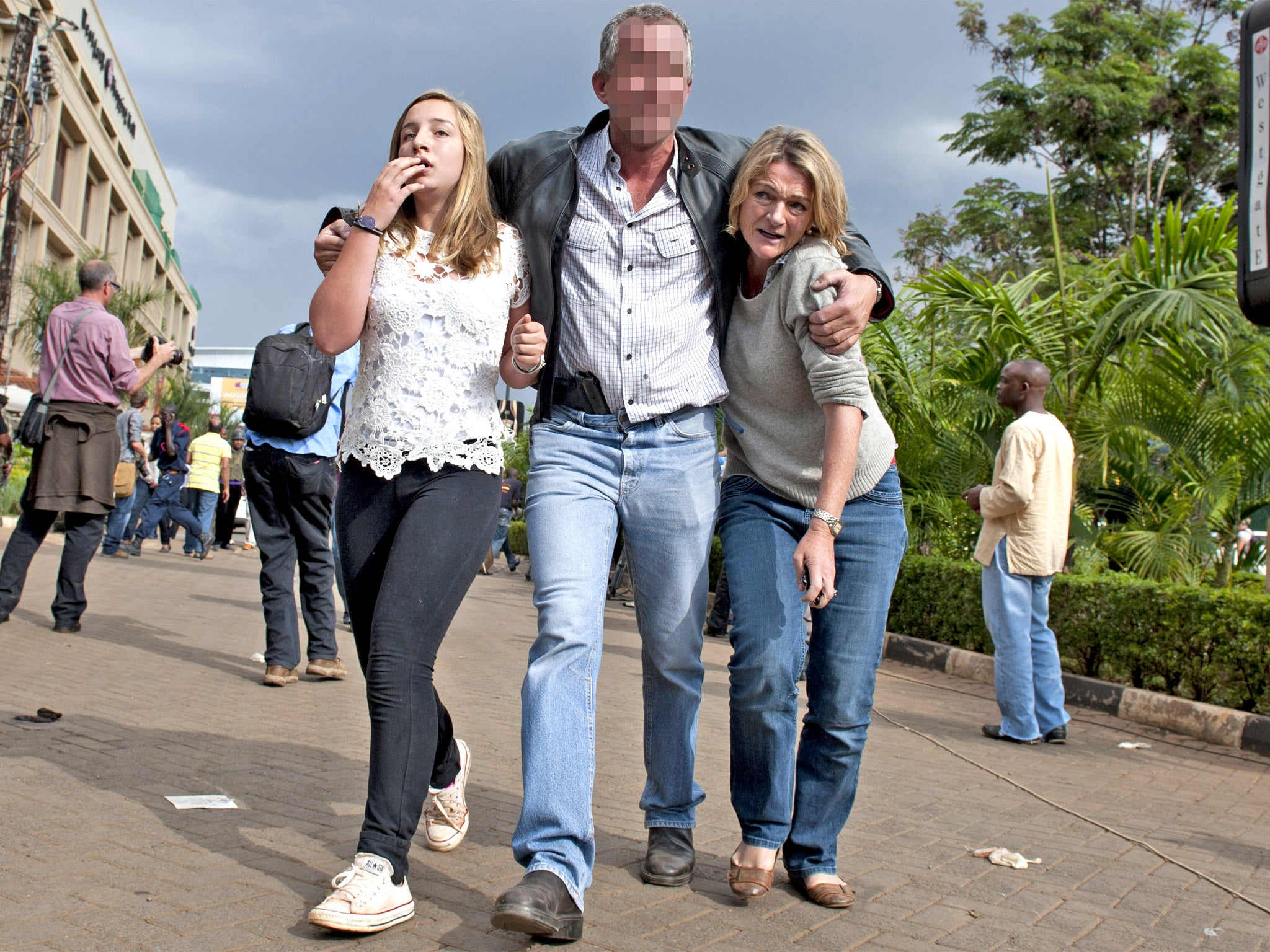 The off-duty SAS soldier helps two women out of the Westgate mall