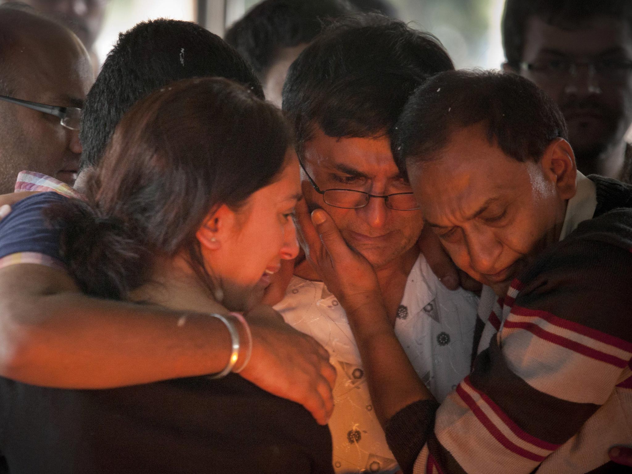 A victim's family mourns at a funeral in Nairobi