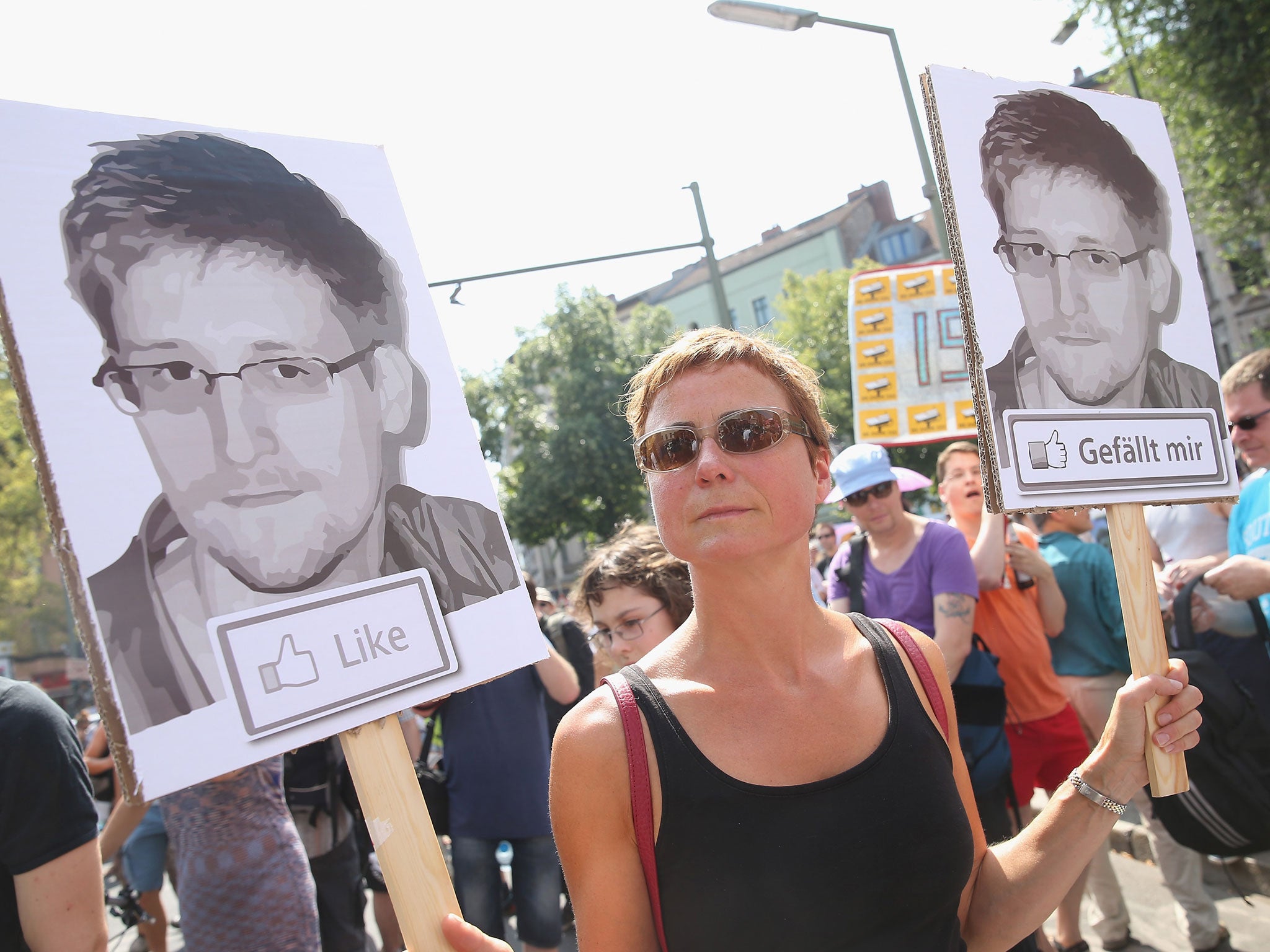 A German demonstrator protests in support of whistleblower and former NSA employee Edward Snowden during a protest in Berlin