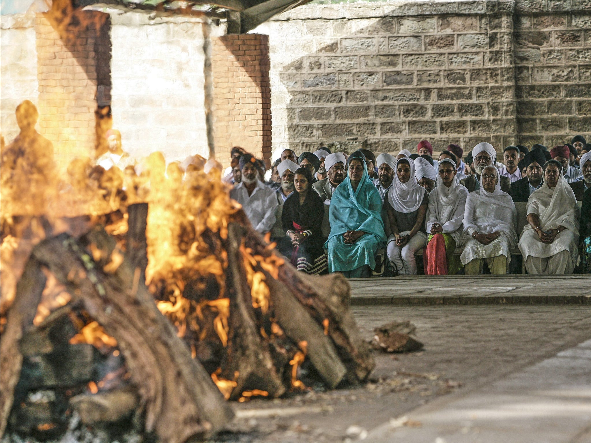 Members of the Kenyan Sikh community come together to cremate a grandmother and son who were killed in the attack