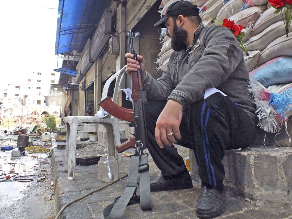 Free Syrian Army soldiers continue to battle regime forces in Homs