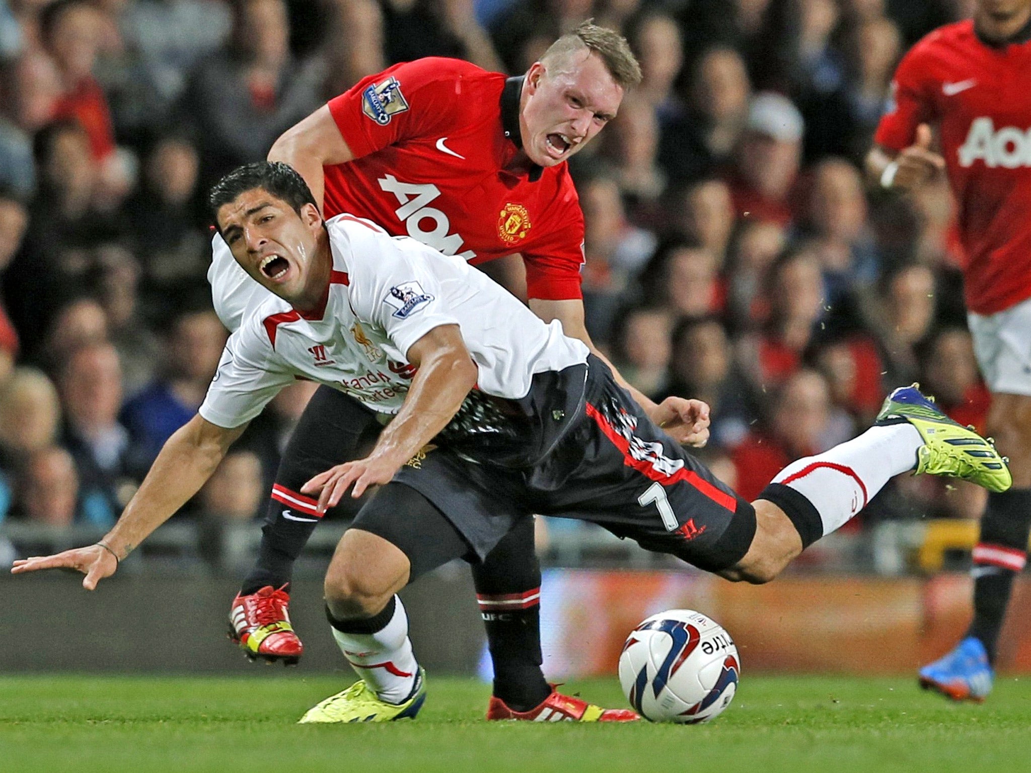 Phil Jones reacquaints Luis Suarez with rough and tumble