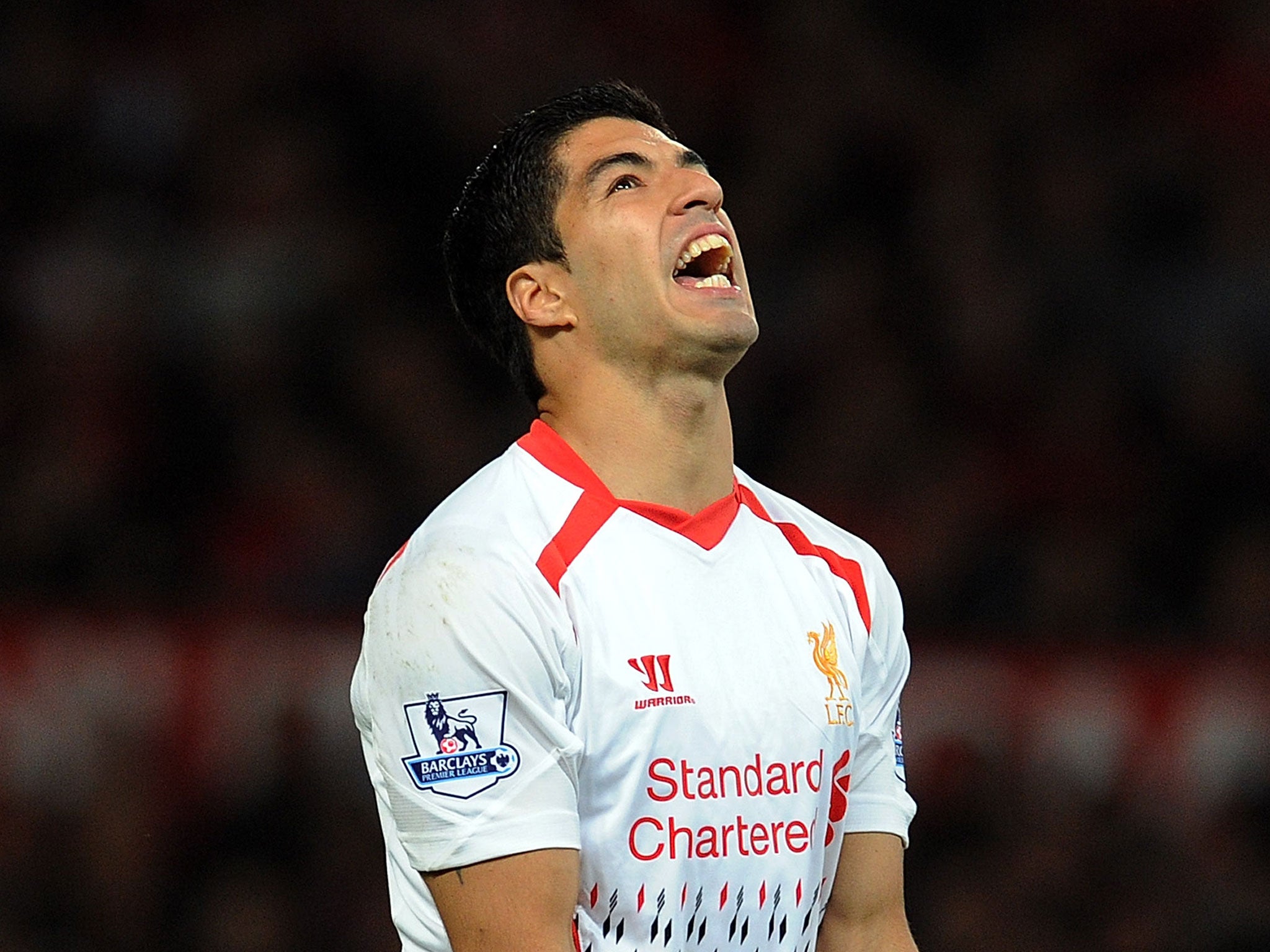 Luis Suarez looks on during his Liverpool return against Manchester United