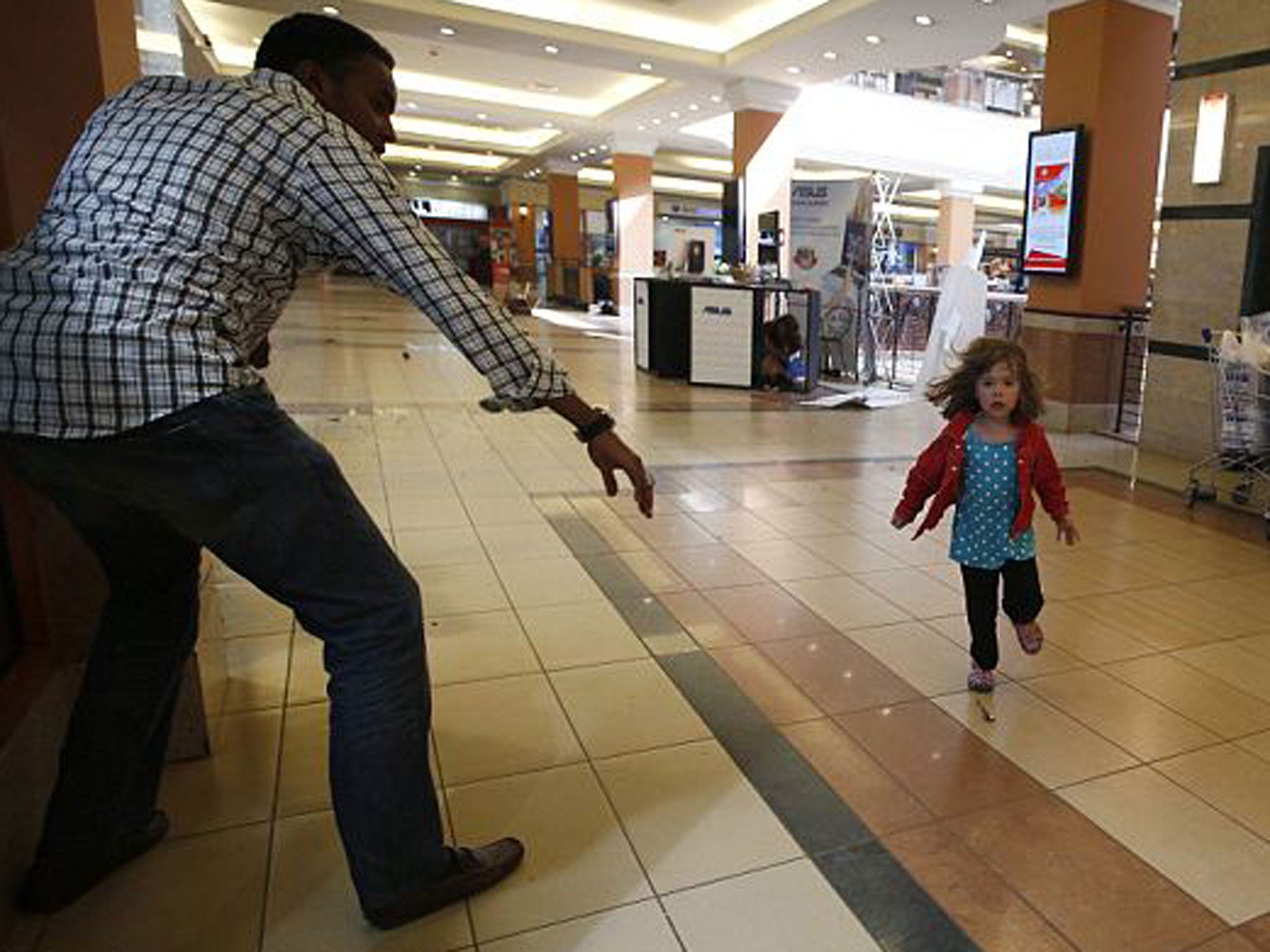 Abdul Haji rescuing four-year-old Portia Walton