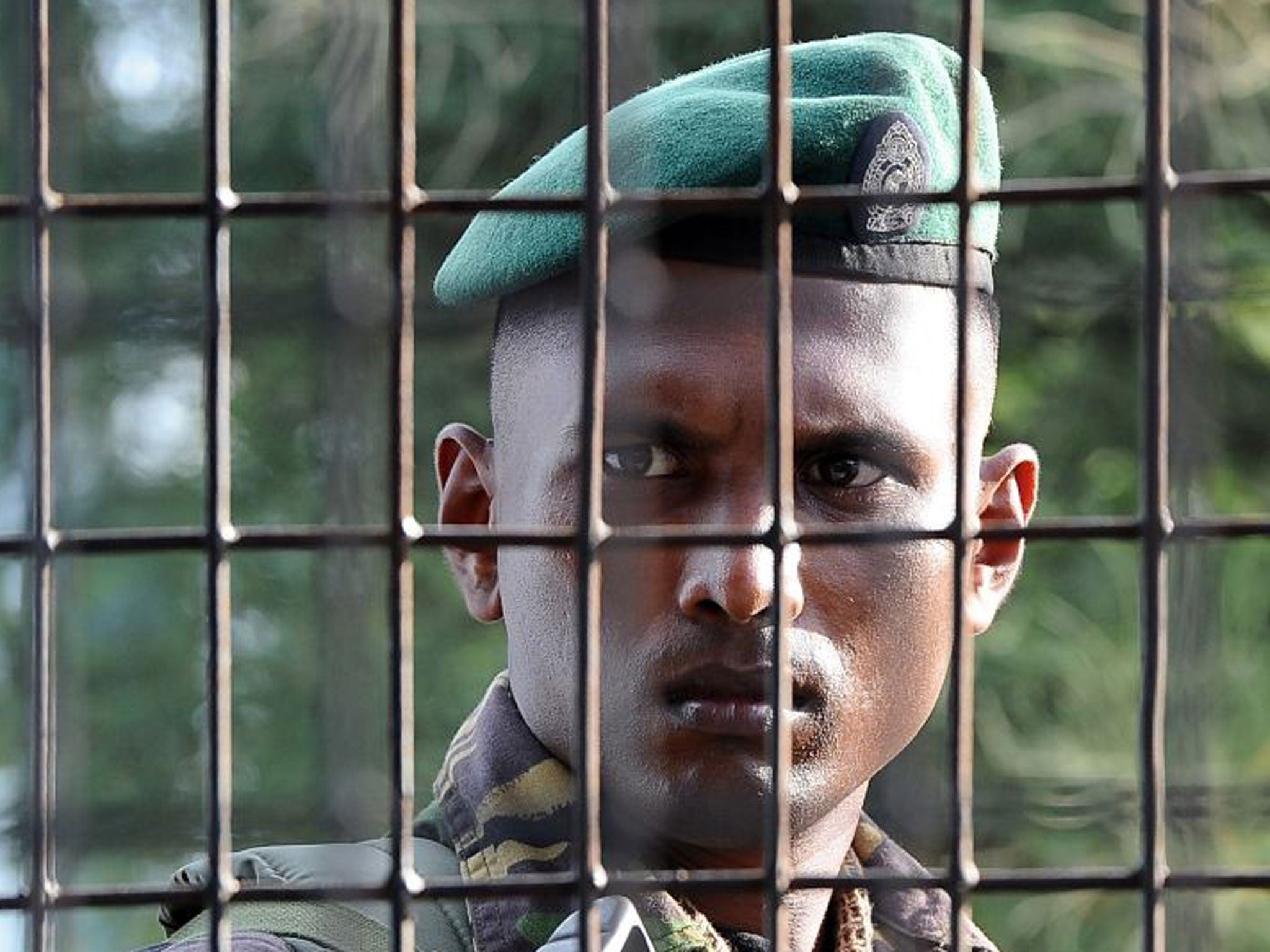 A Sri Lanka Special Task Force soldier stands guard at a main counting centre in Jaffna