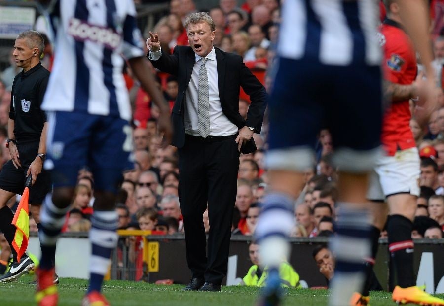 Red hot seat: Manager David Moyes watches his side losing 2-1 at home to West Bromwich Albion. United’s third League defeat of the season leaves them a lowly 12th in the table