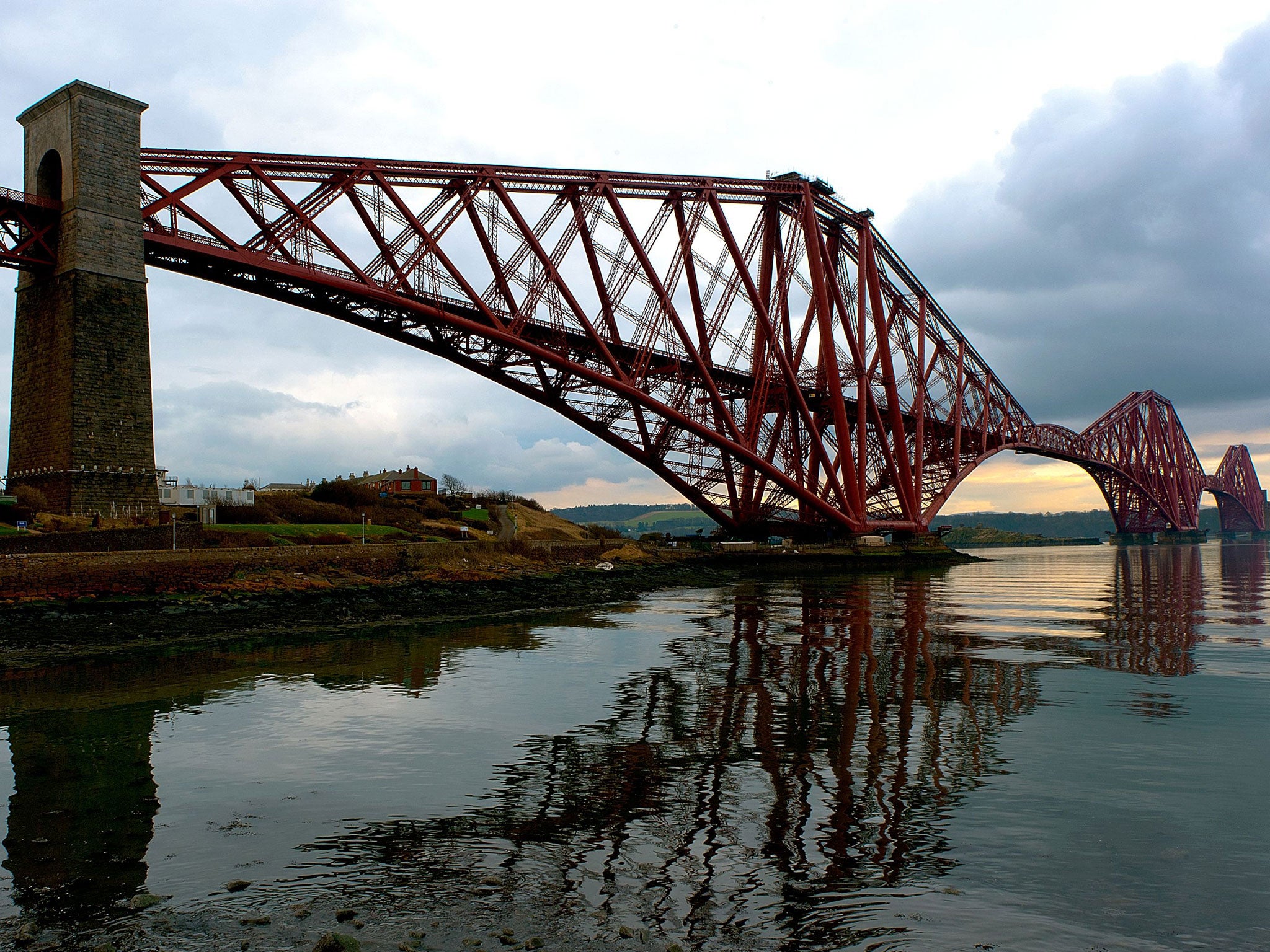 Dr Bradley Garrett climbed the 110m-high bridge with friends and described the feeling as though he was ‘riding a dragon’