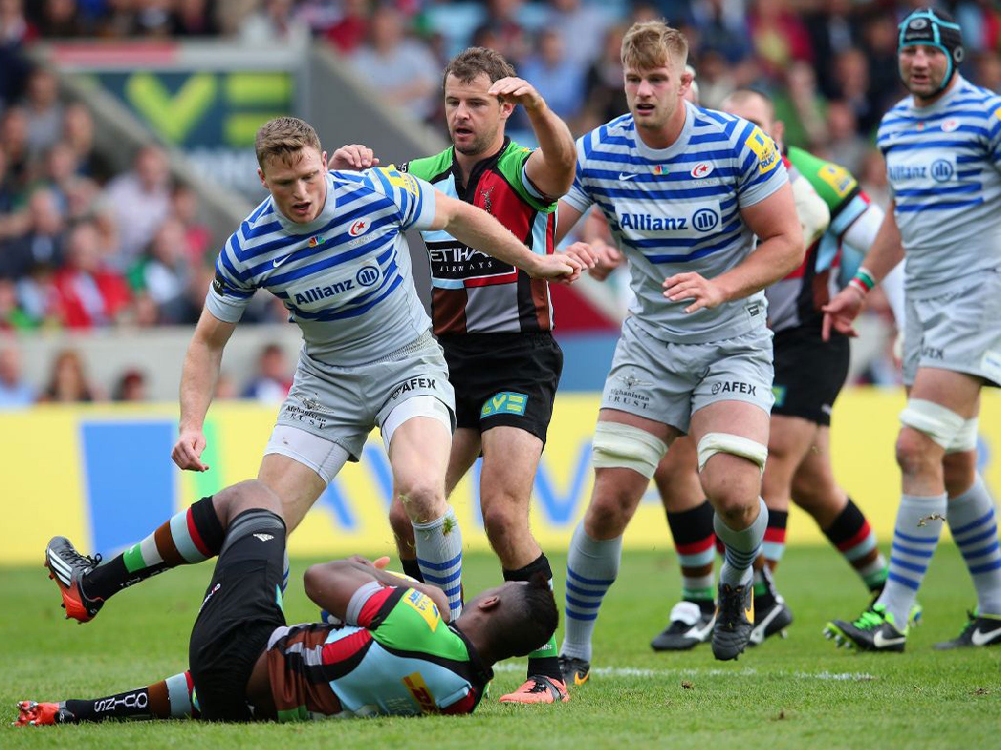 Saracens’ Chris Ashton tangles with Harlequins’ Ugo Monye