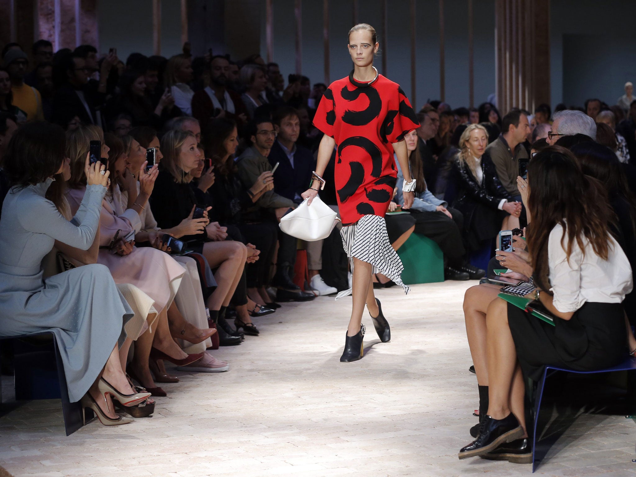 A model presents a creation by British designer Phoebe Philo from her Spring/Summer 2014 women's ready-to-wear collection for fashion house Céline during Paris Fashion Week