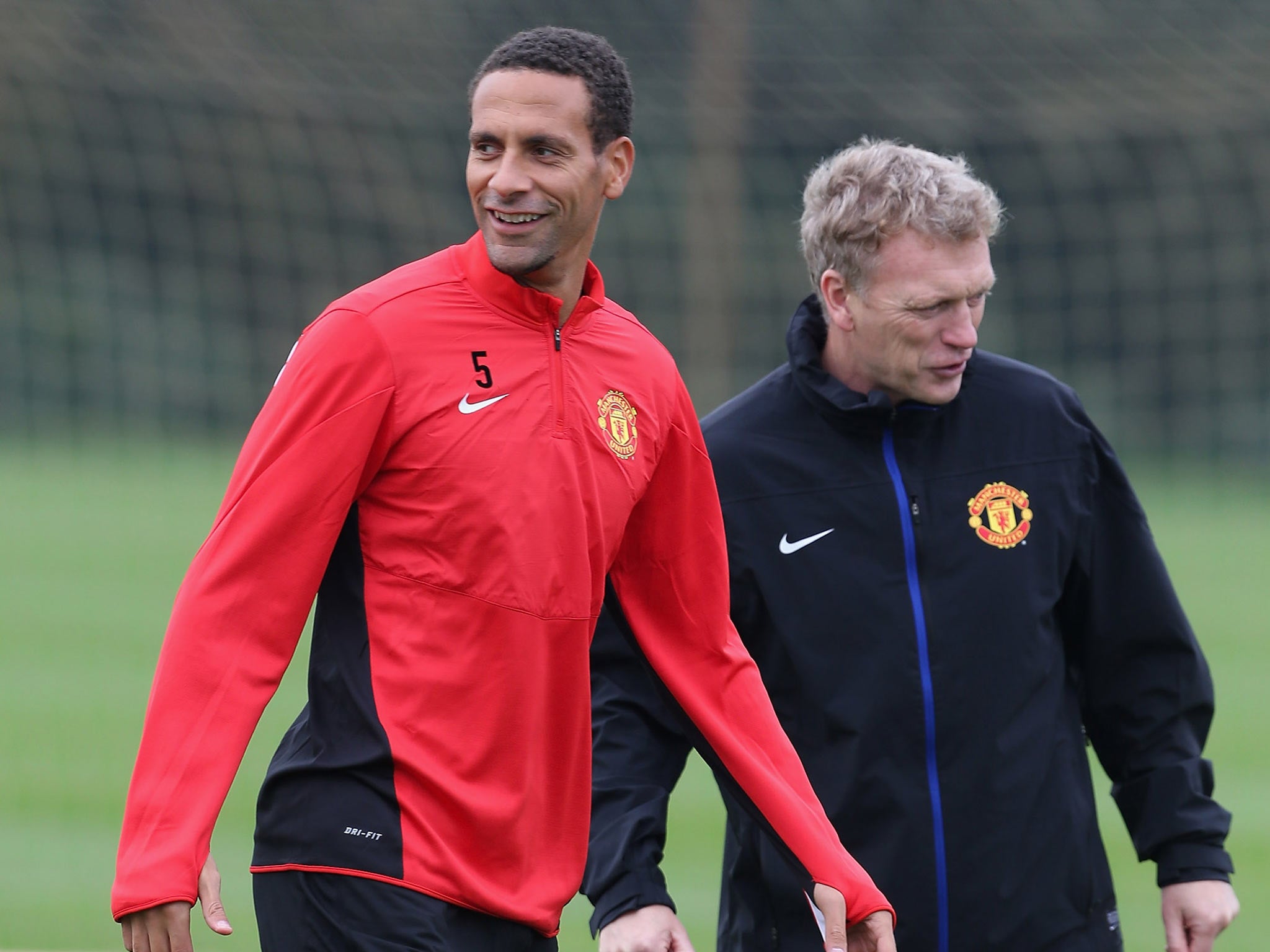 Rio Ferdinand pictured training alongside David Moyes