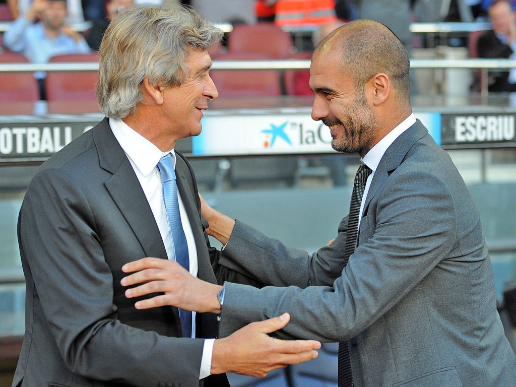 Pellegrini and Guardiola before a match between Malaga and Barcelona two seasons ago