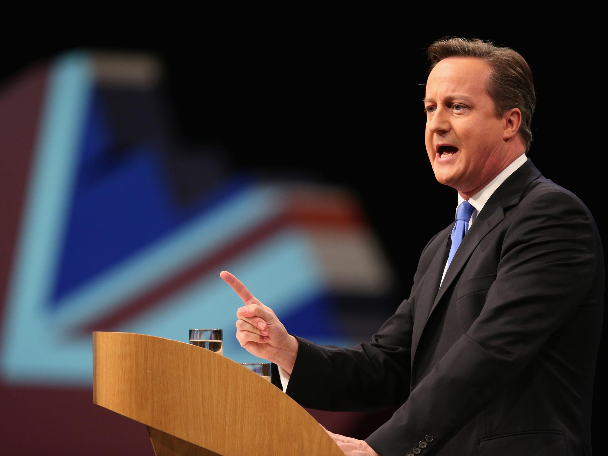 British Prime Minster David Cameron delivers his keynote speech on the last day of the annual Conservative Party Conference at Manchester Central