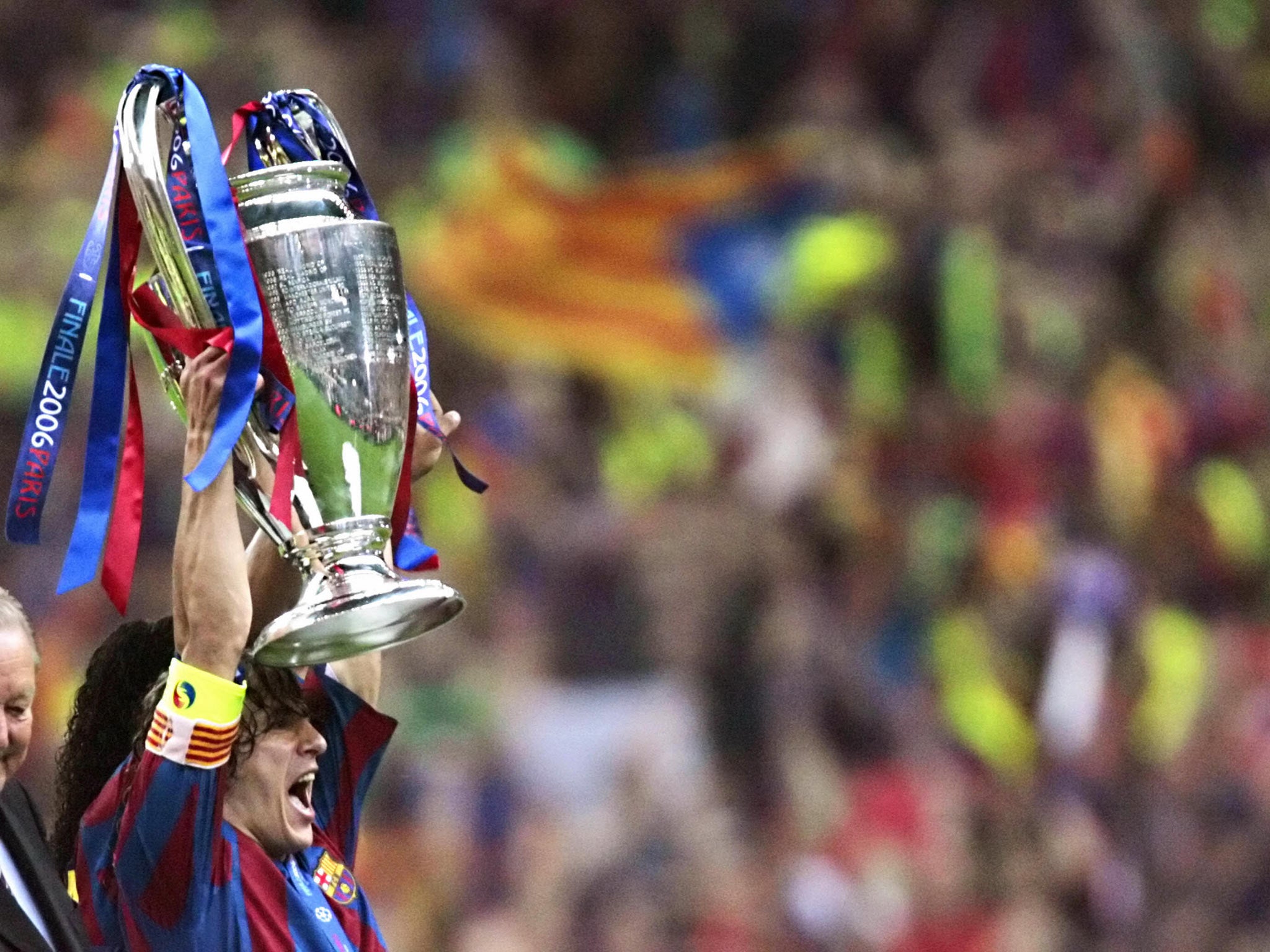 Puyol pictured lifting the Champions League trophy