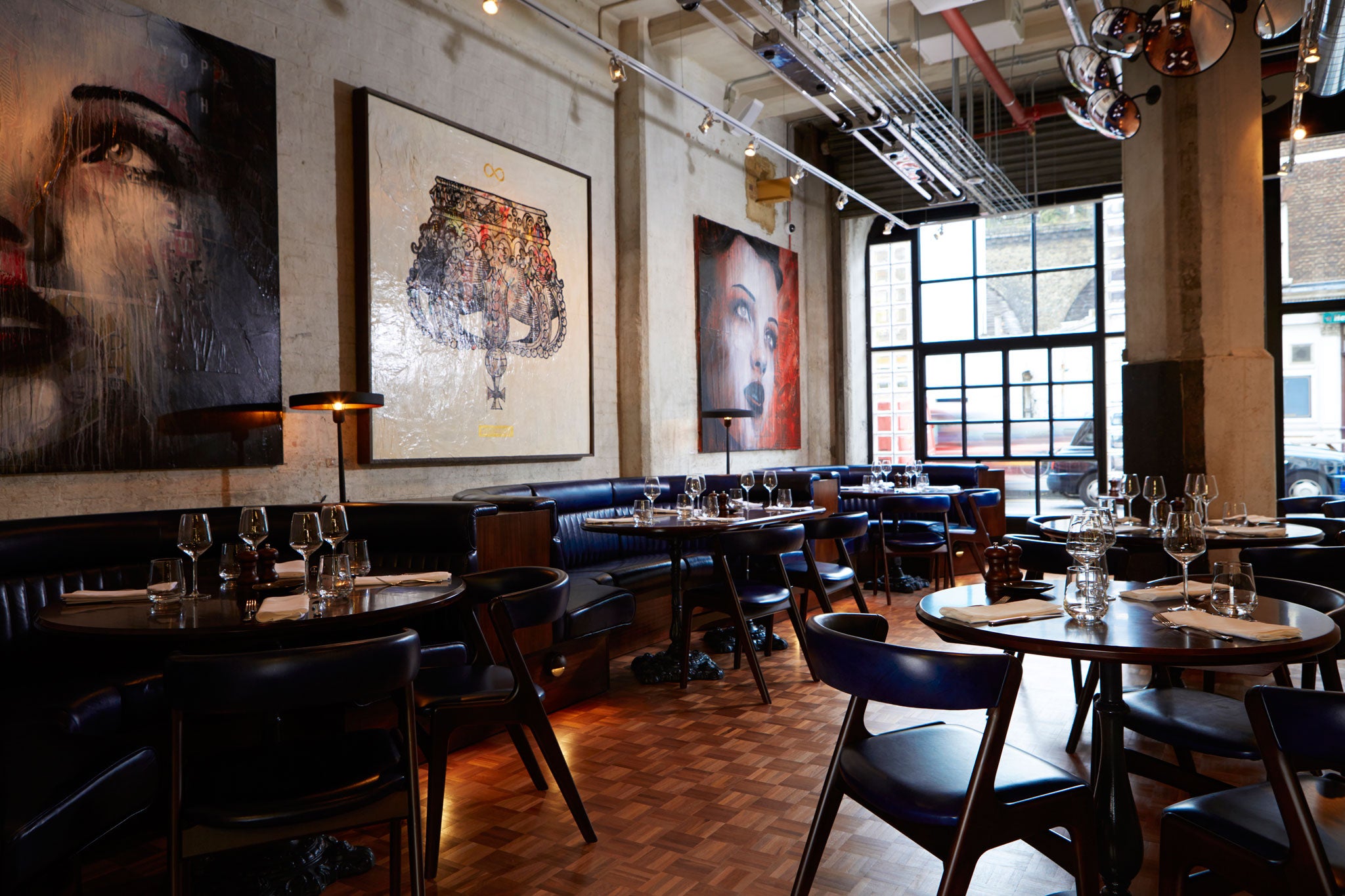 Studied informality: Union Street Café features untreated concrete pillars, fat ventilation shafts and wire-basket lighting