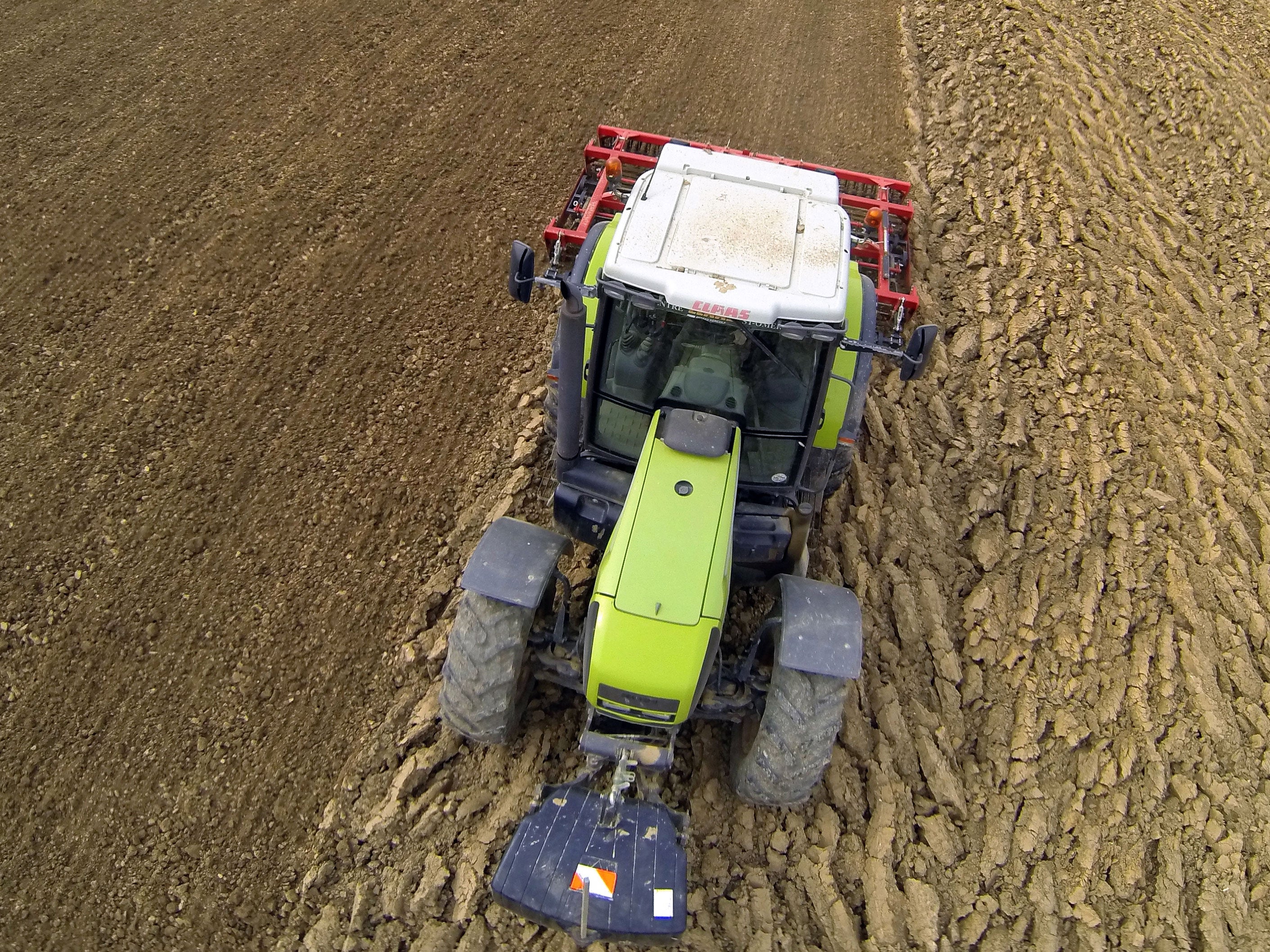 A man used a pocket knife to dig himself free after a tractor pinned him to the ground for more than six hours.